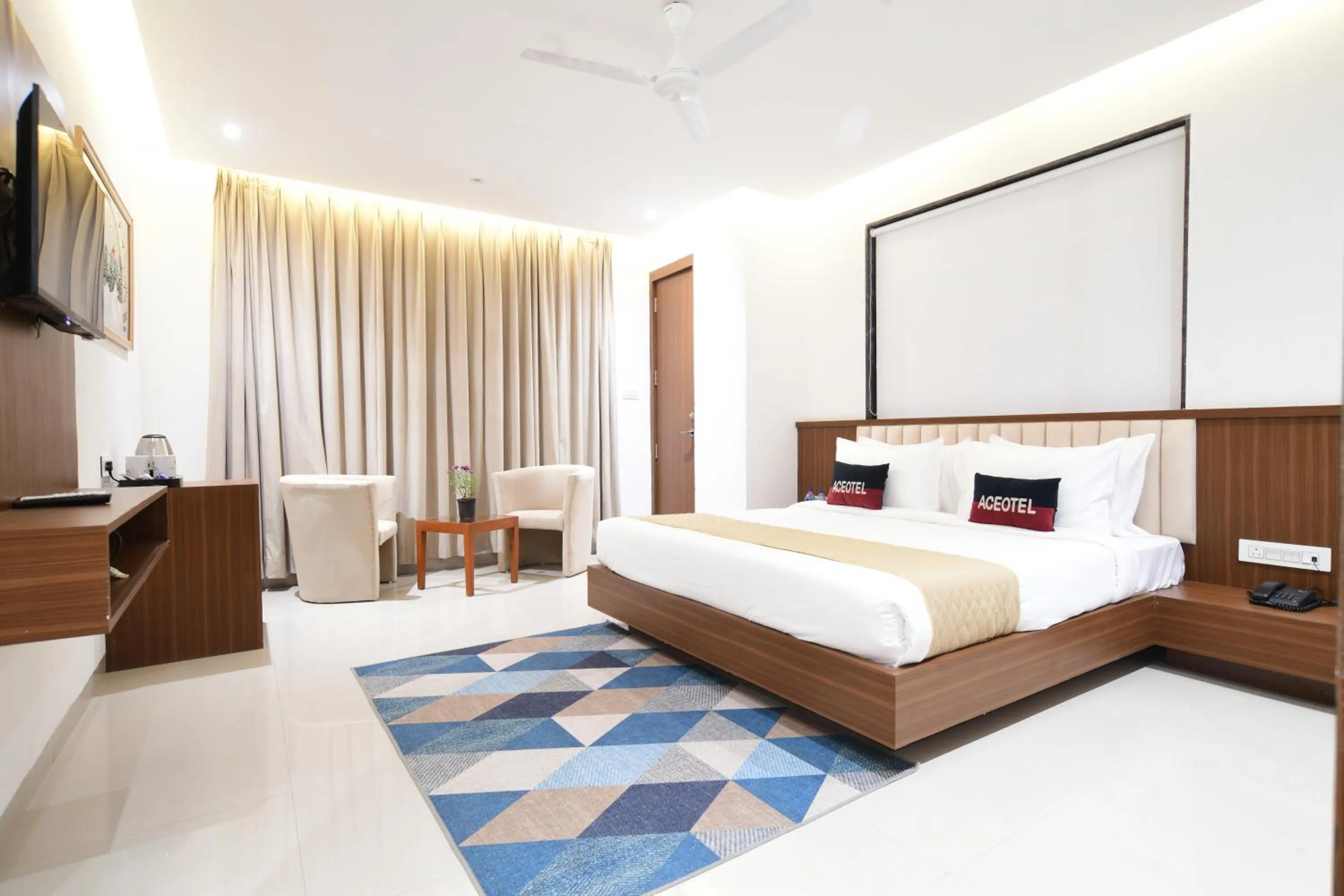 Communal lounge/ TV room, Bed in Aceotel Premier, Vijay Nagar