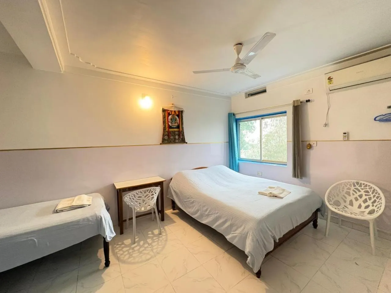 Seating area, Bed in Tara Guest House