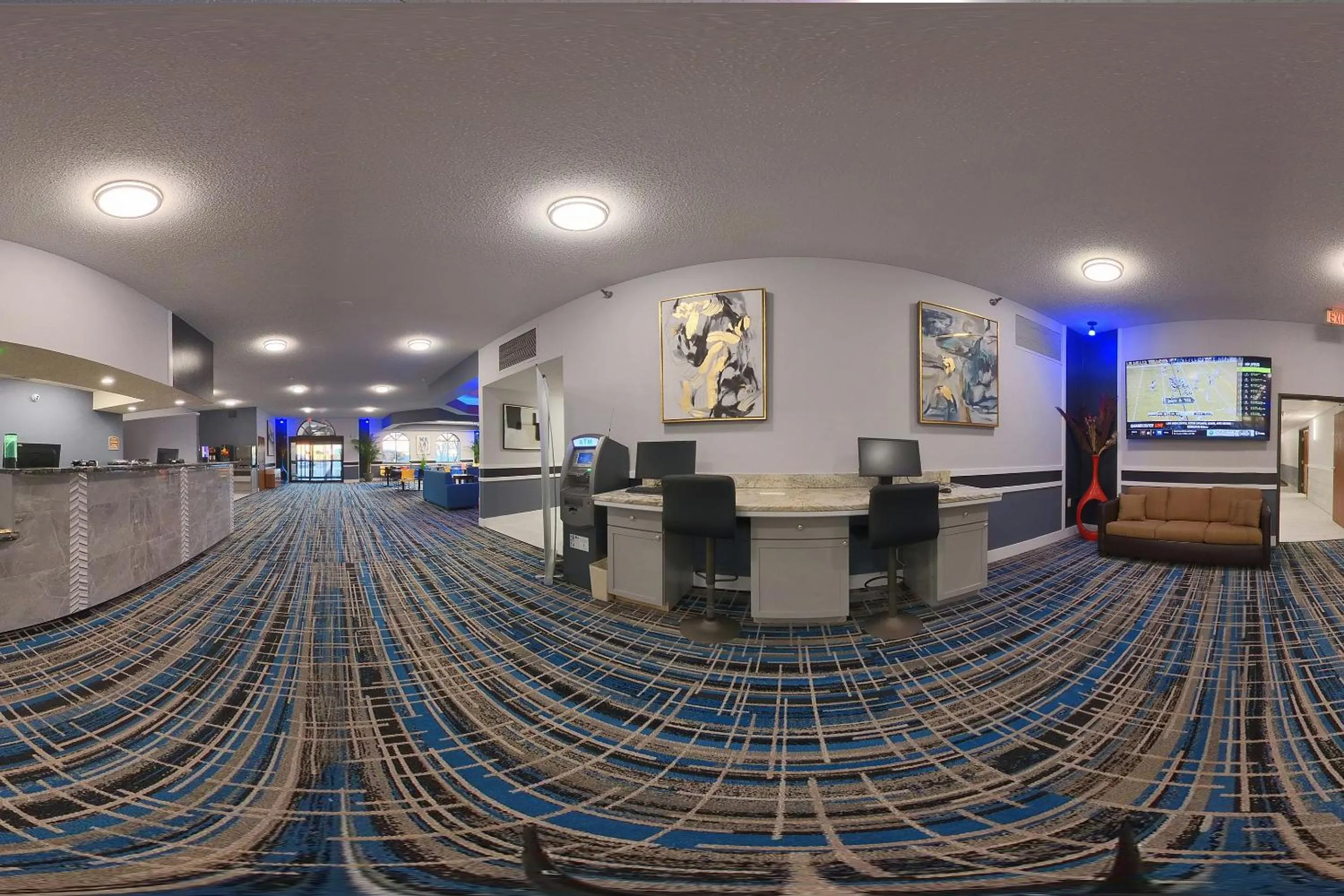 TV and multimedia in Coratel Inn and Suites By Jasper Eagan ST Paul Airport & Mall of America