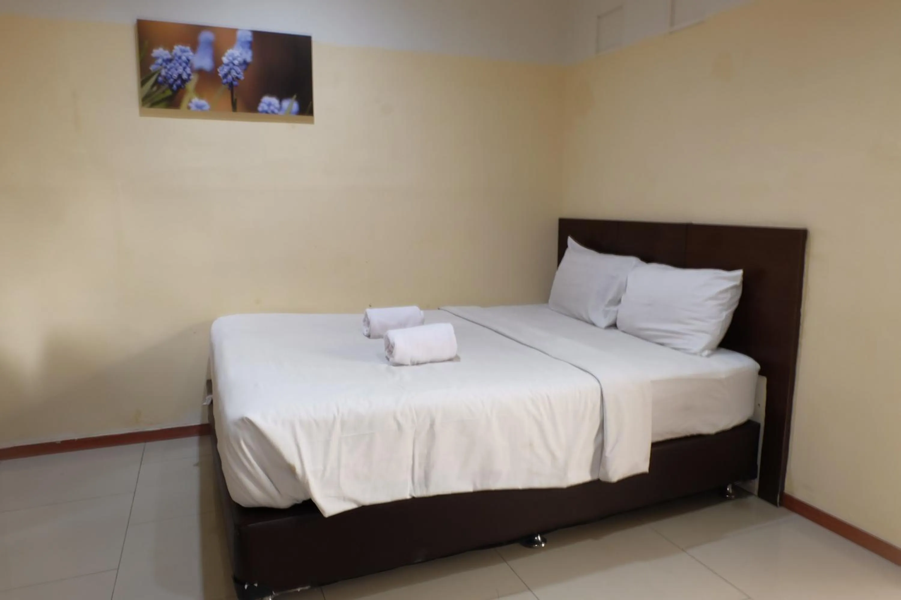 Bed in De Nusantara Hotel Syariah