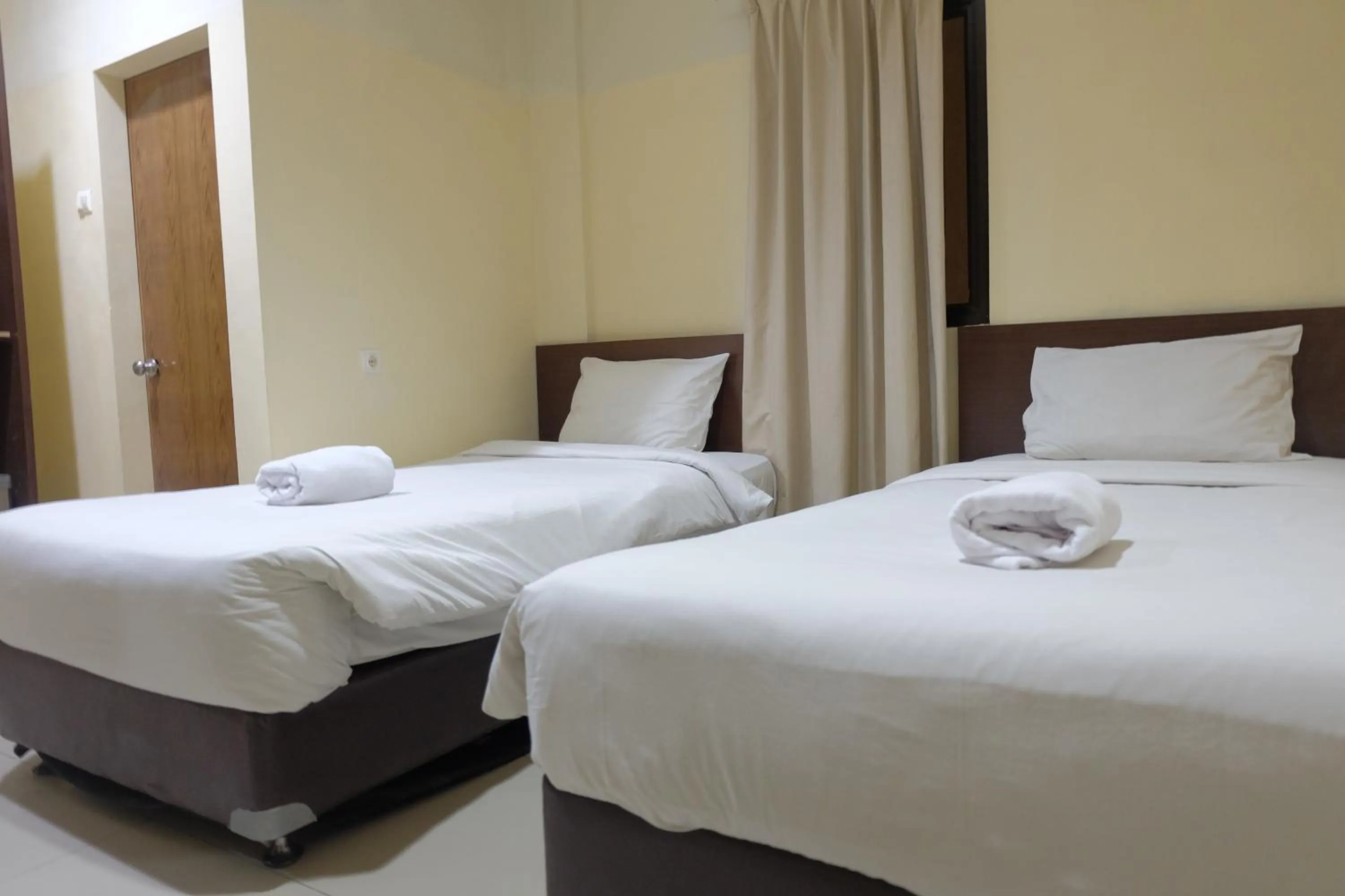 Bed in De Nusantara Hotel Syariah