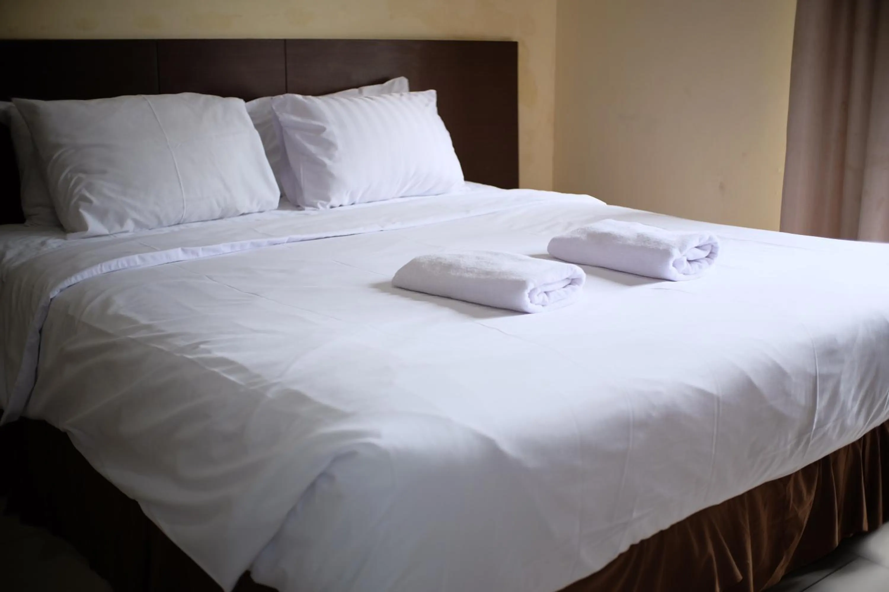 Bed in De Nusantara Hotel Syariah