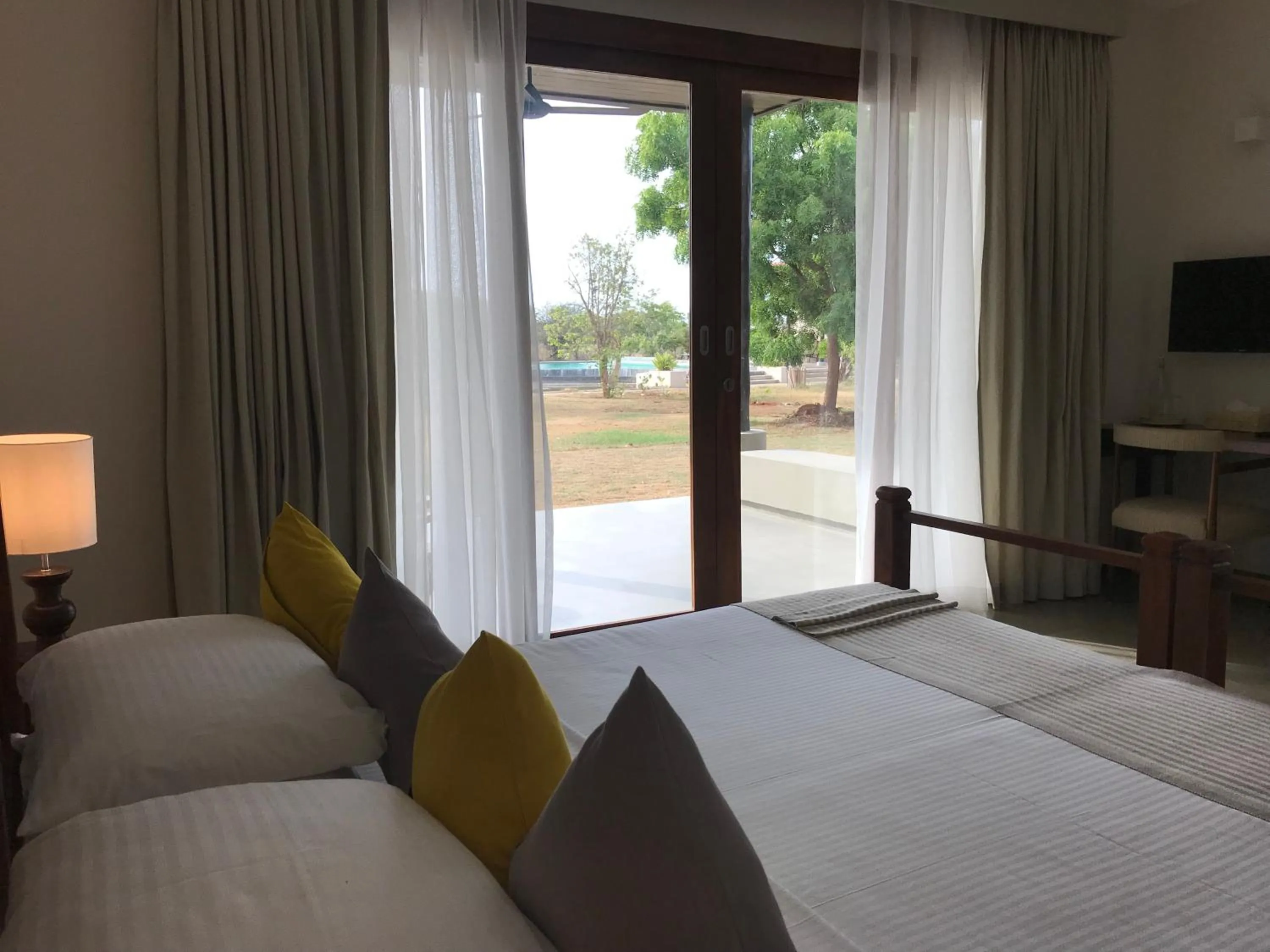 Pool view, Bed in The Palmyrah House