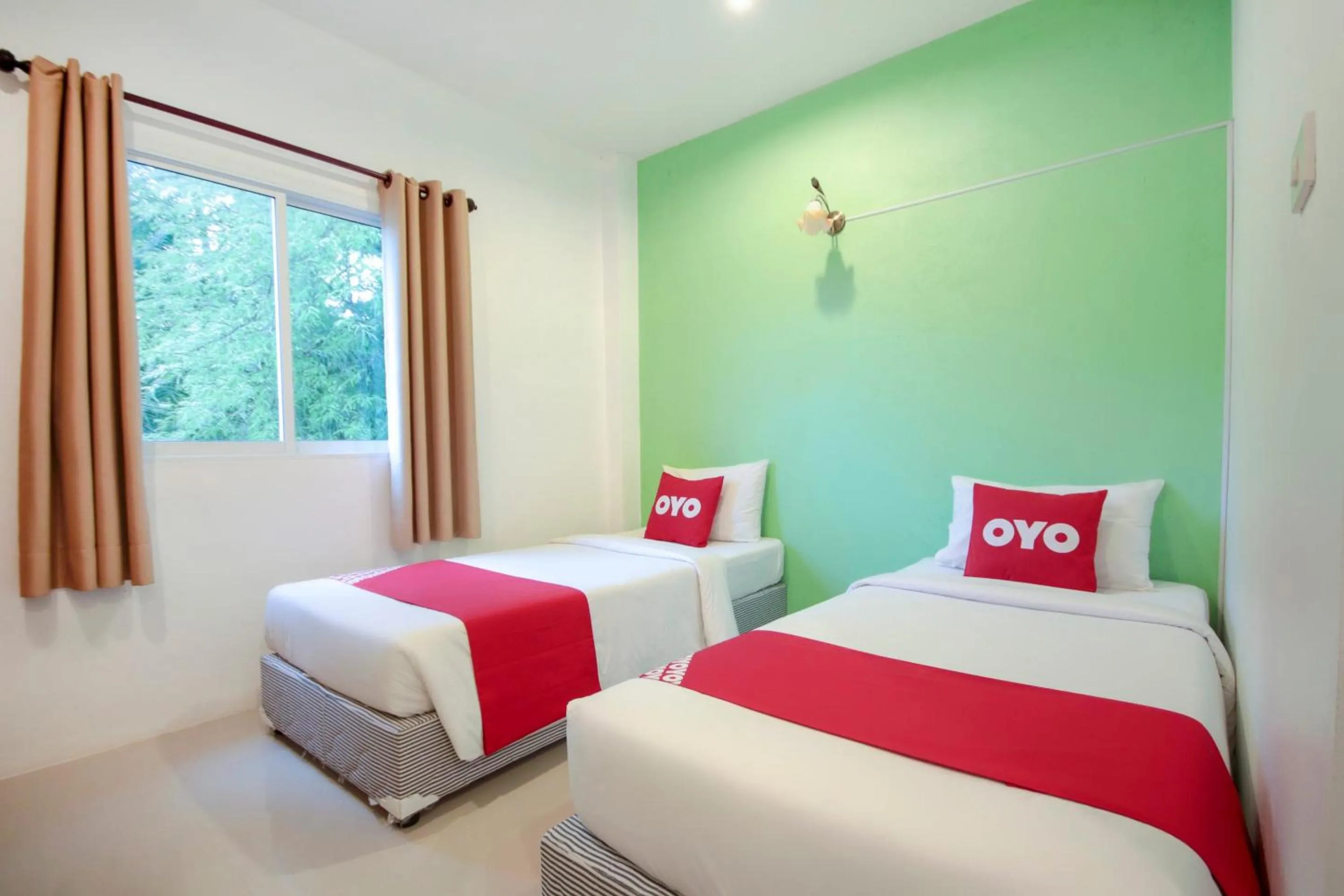 Bedroom in OYO 1120 The Royhanna Beach Home