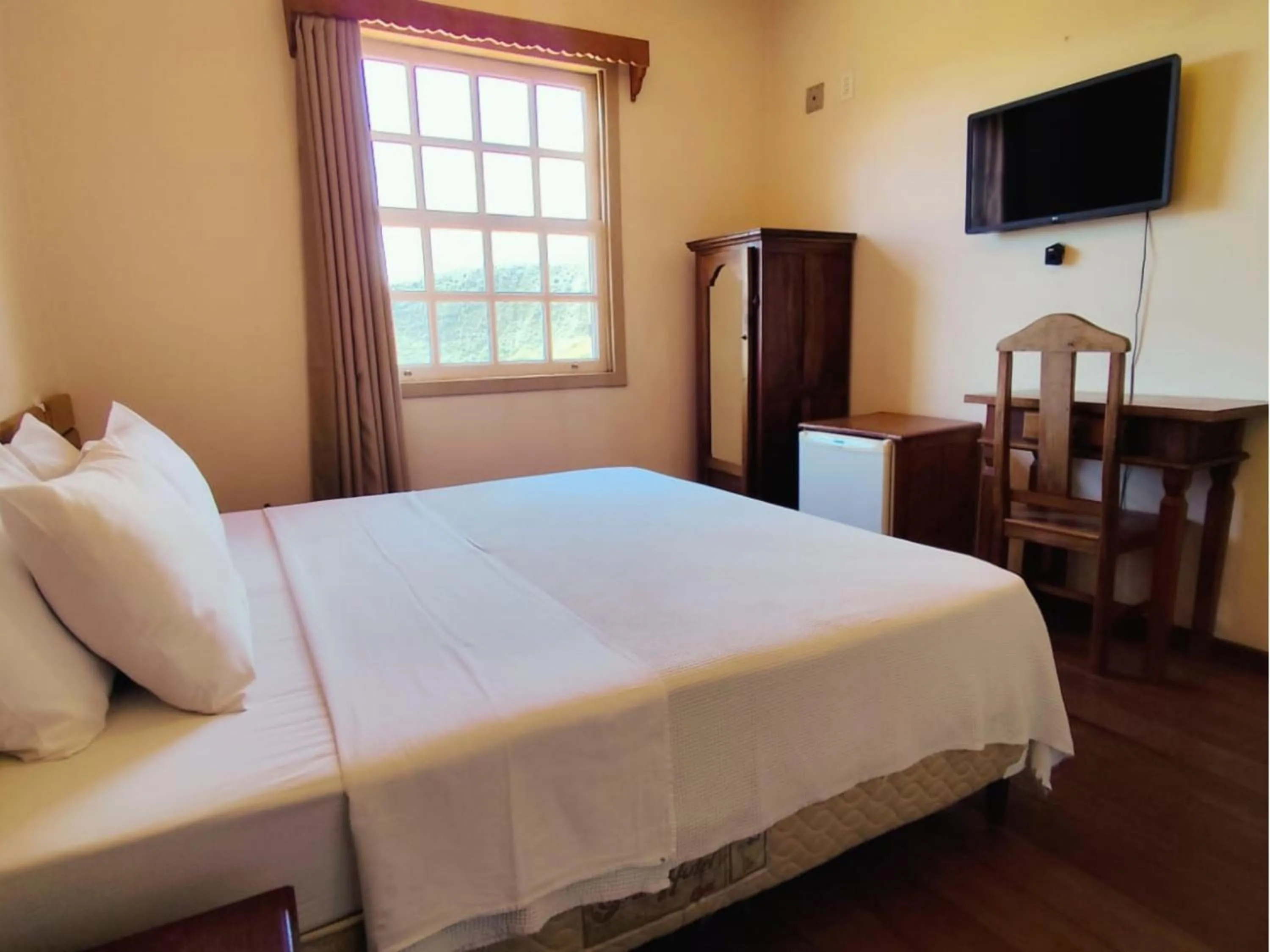 Bed in Pousada Geraes