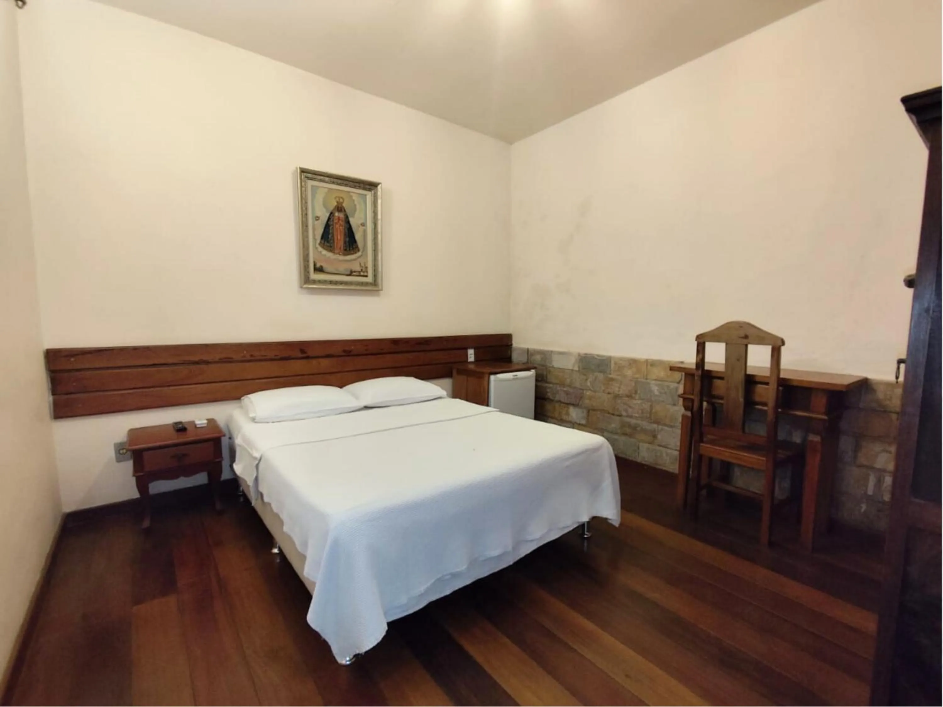 Bed in Pousada Geraes