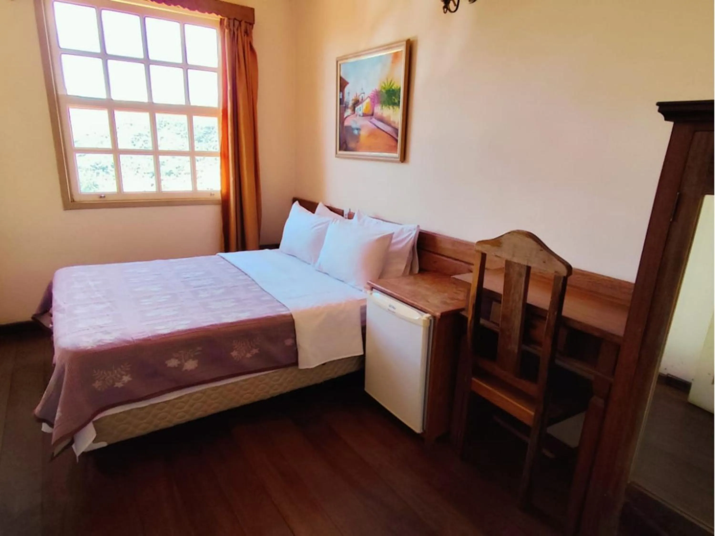Bed in Pousada Geraes