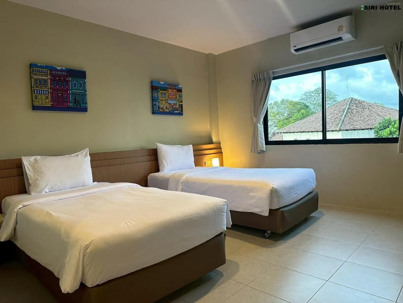 Bed in Siri Hotel Phuket
