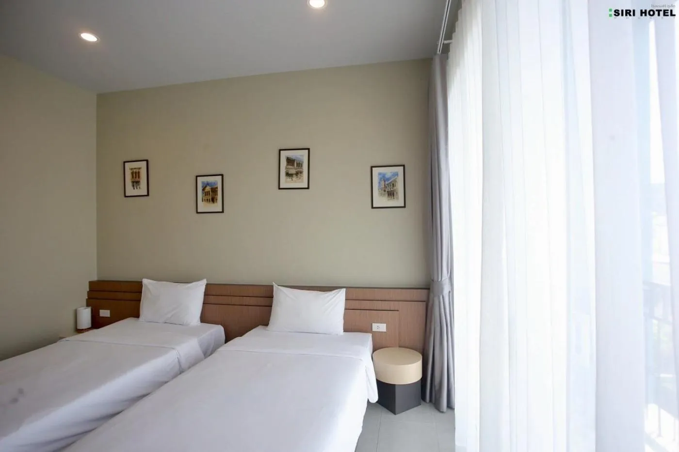 Bed in Siri Hotel Phuket