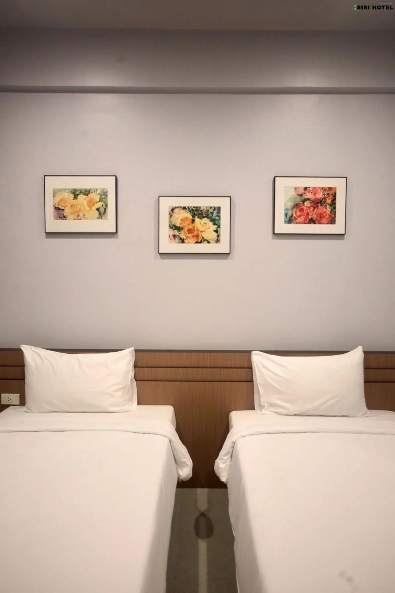 Bed in Siri Hotel Phuket
