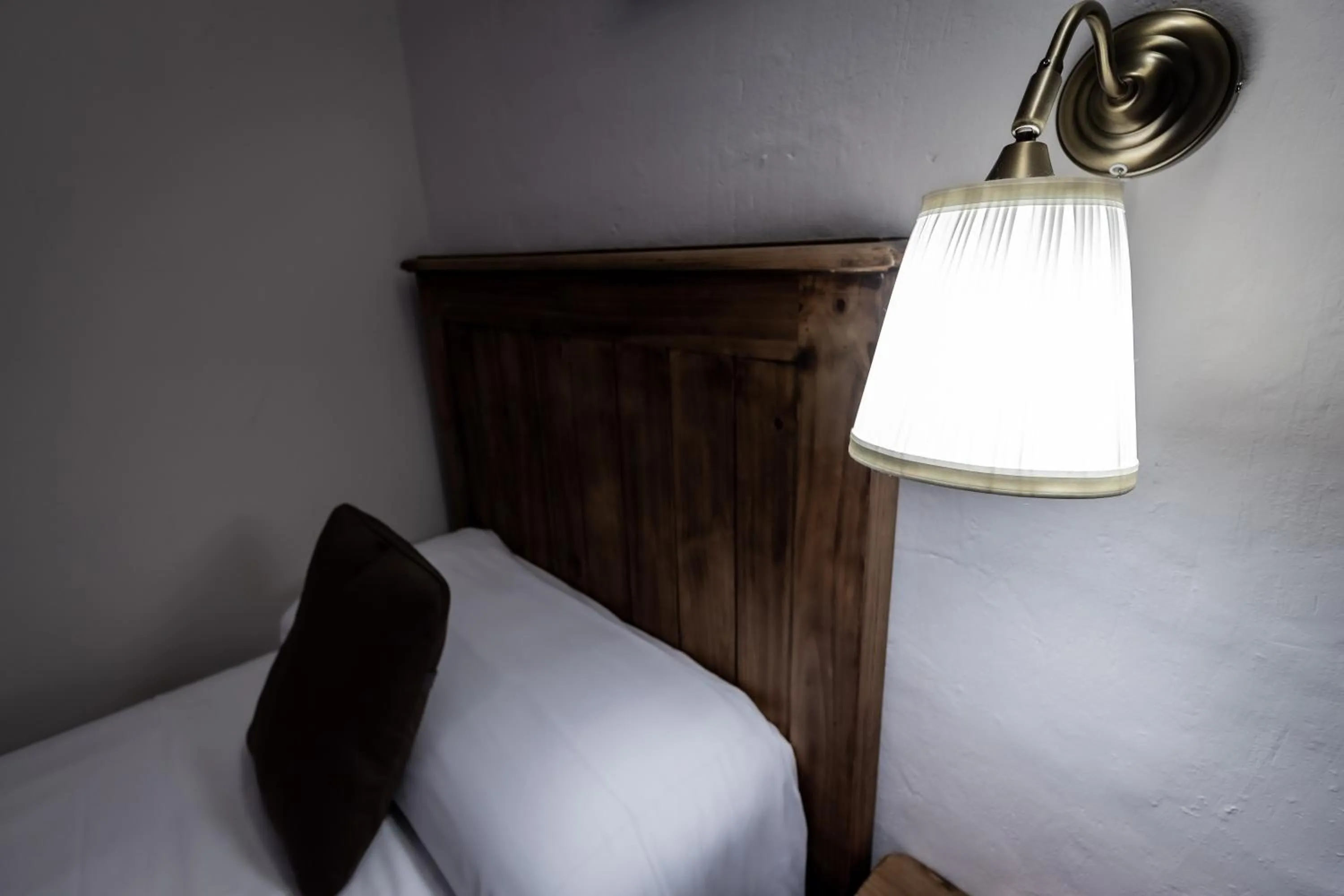 Decorative detail, Bed in Posada Peña Pintada by Vivere Stays