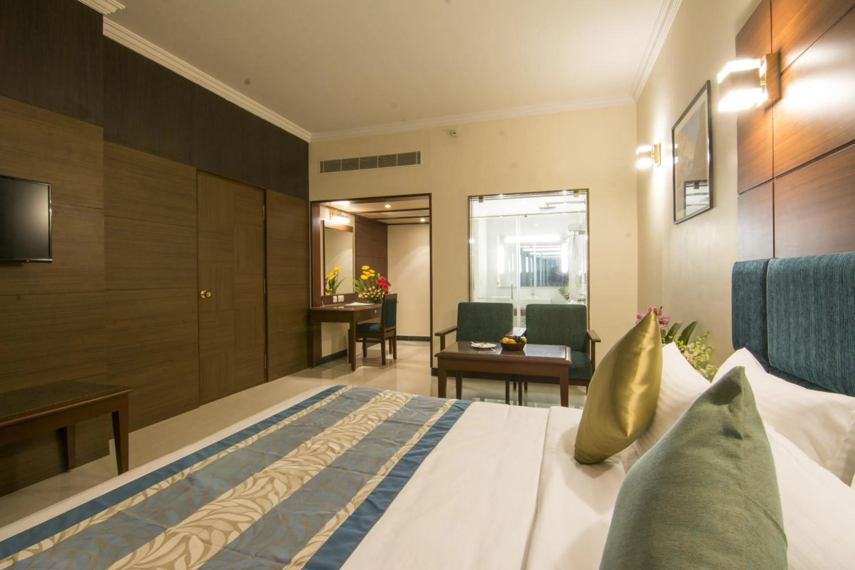 Photo of the whole room, Bed in Shenbaga Hotel And Convention Centre