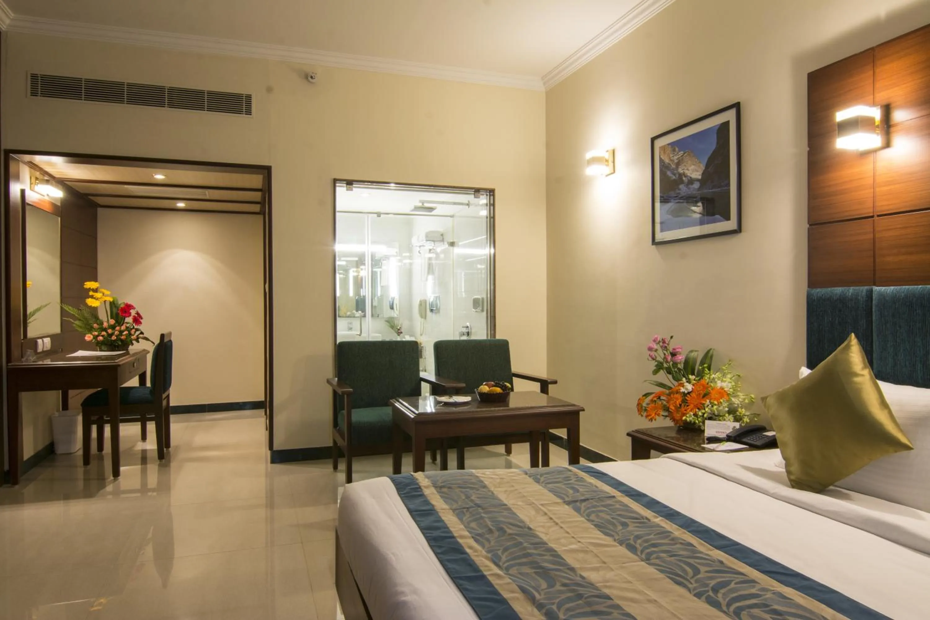 Seating area, Bed in Shenbaga Hotel And Convention Centre