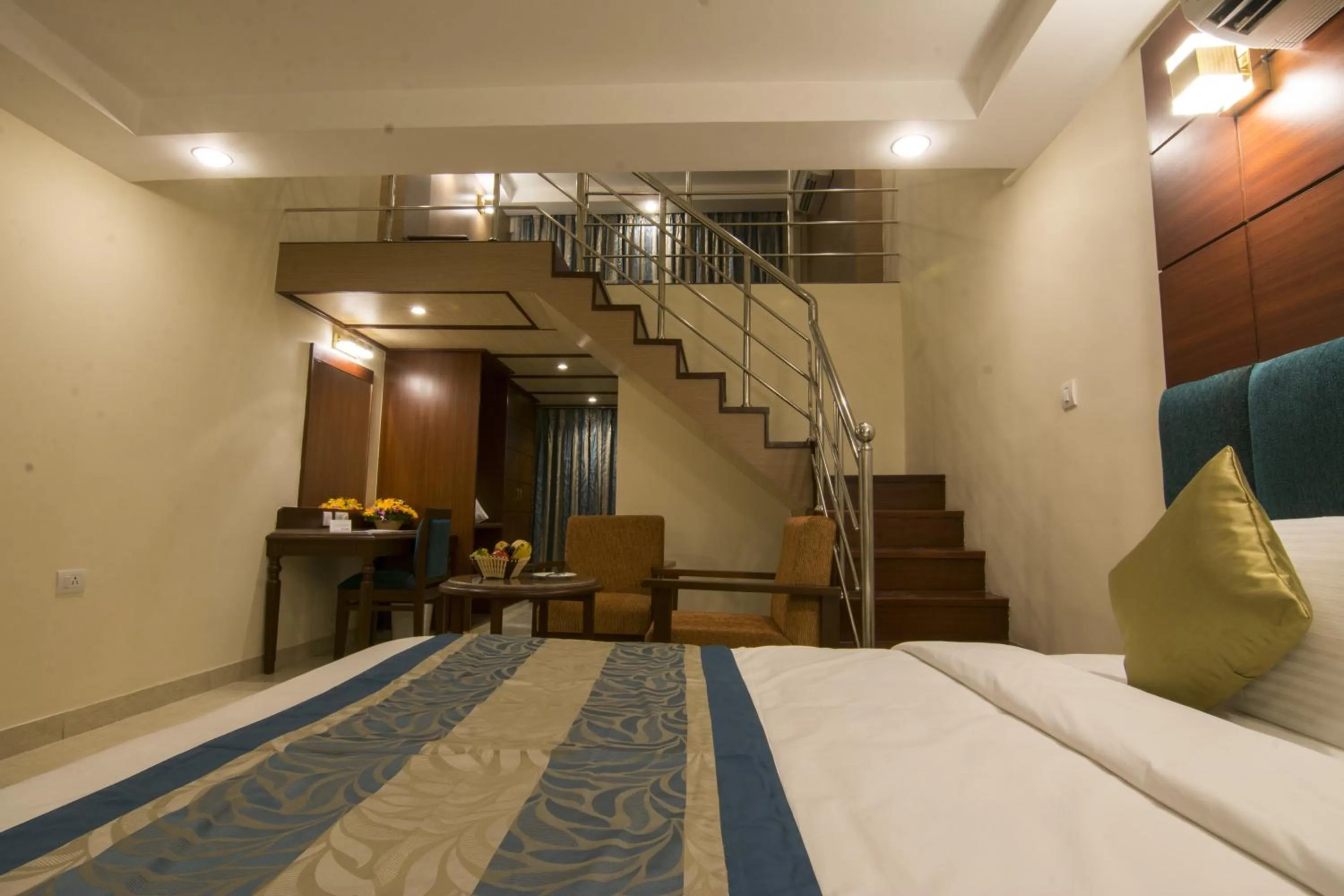 Seating area, Bed in Shenbaga Hotel And Convention Centre