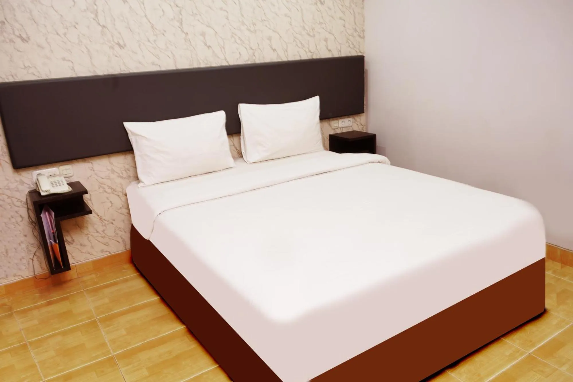 Bed in Grande Hotel Lampung Powered by Archipelago