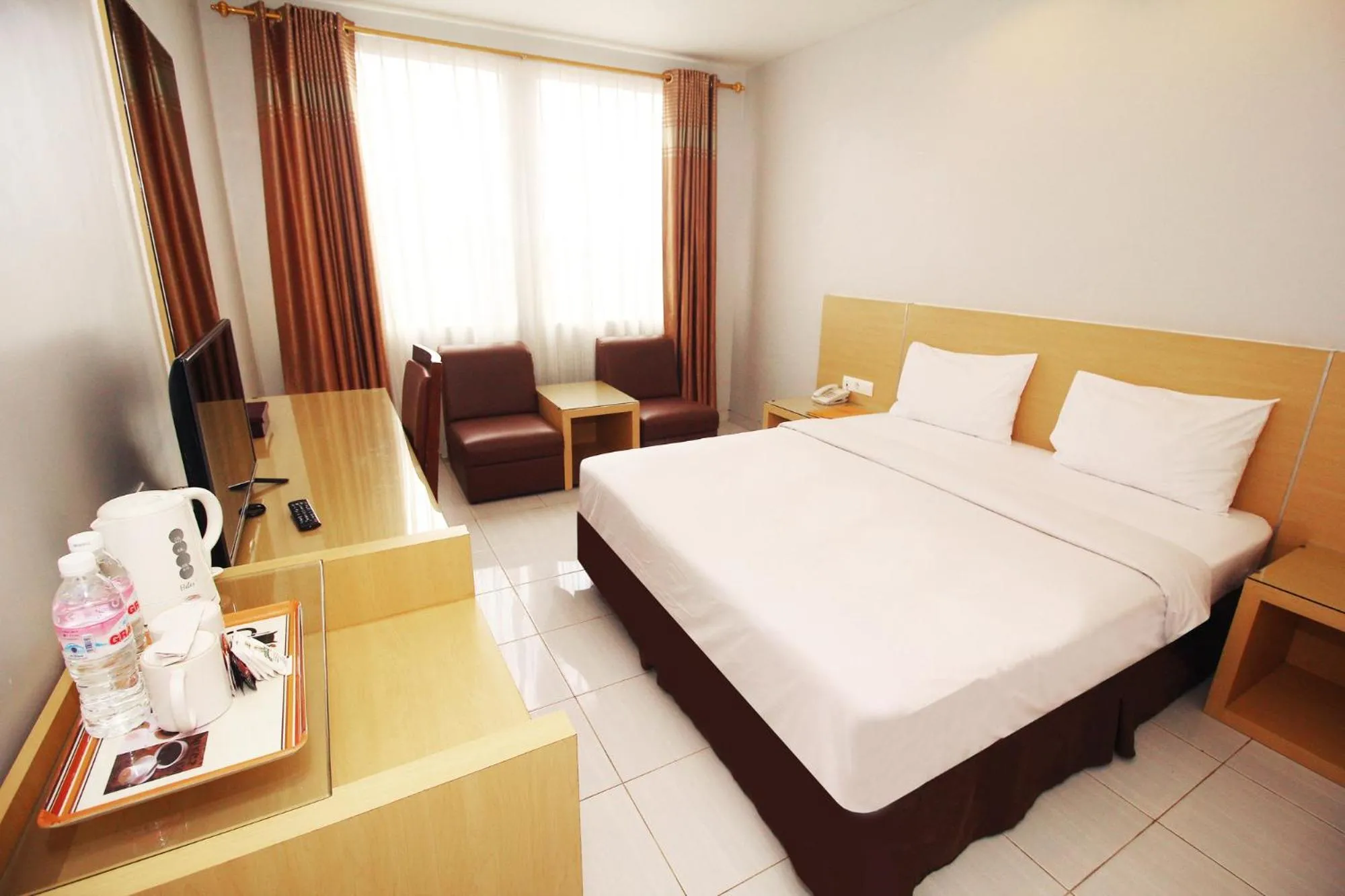 Bed in Grande Hotel Lampung Powered by Archipelago