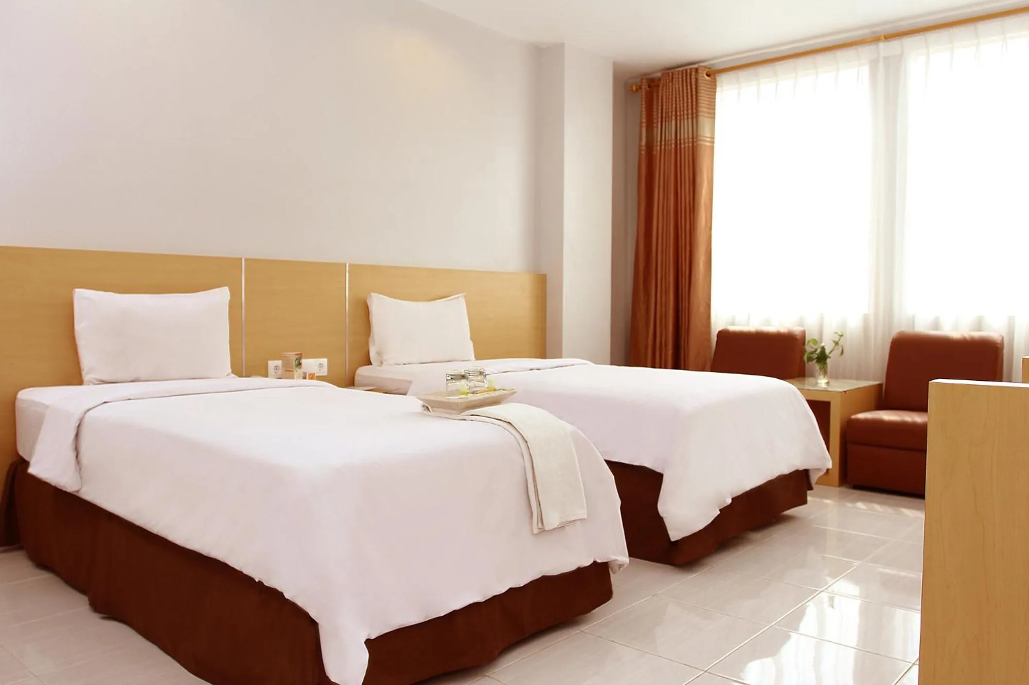 Bed in Grande Hotel Lampung Powered by Archipelago