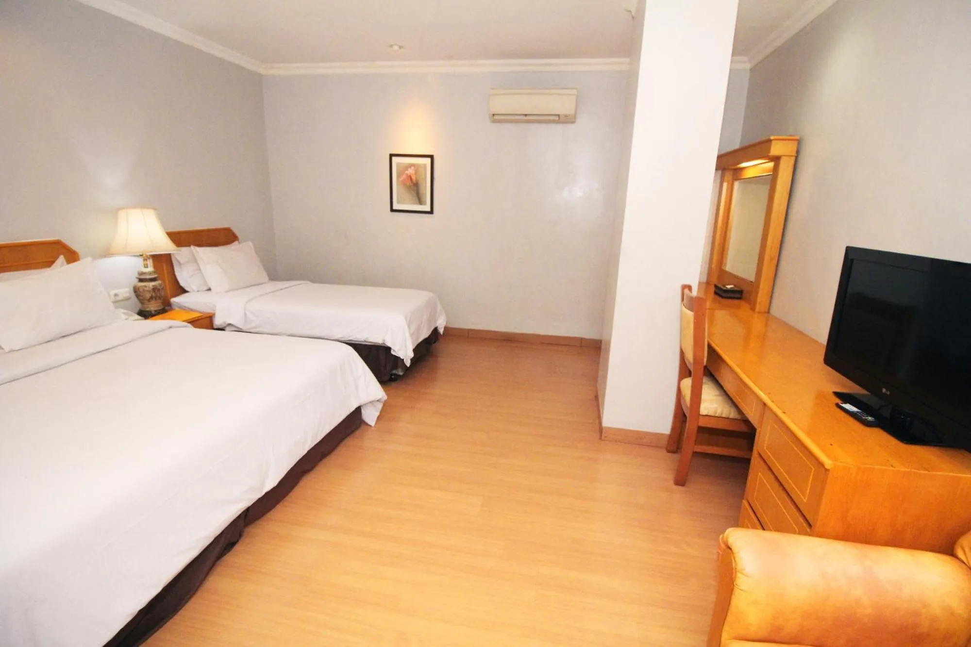Bed in Grande Hotel Lampung Powered by Archipelago