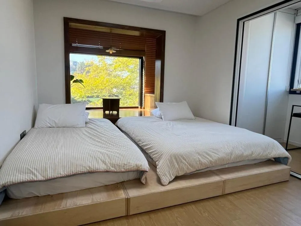 Bed in Jeju Ianstay