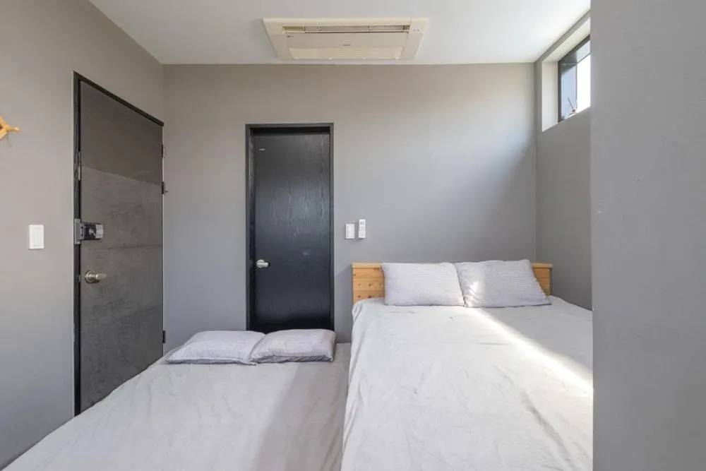 Bed in Geoje Yolo Guesthouse