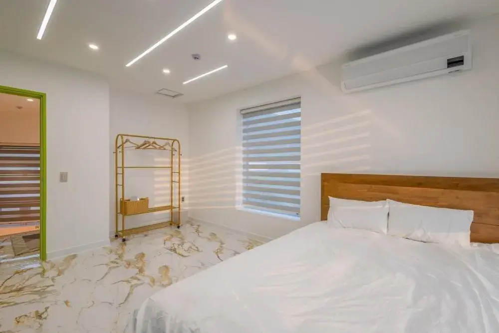 Bed in Namhae Boolgeun Noeul Pool Villa Bed in Namhae Boolgeun Noeul Pool Villa