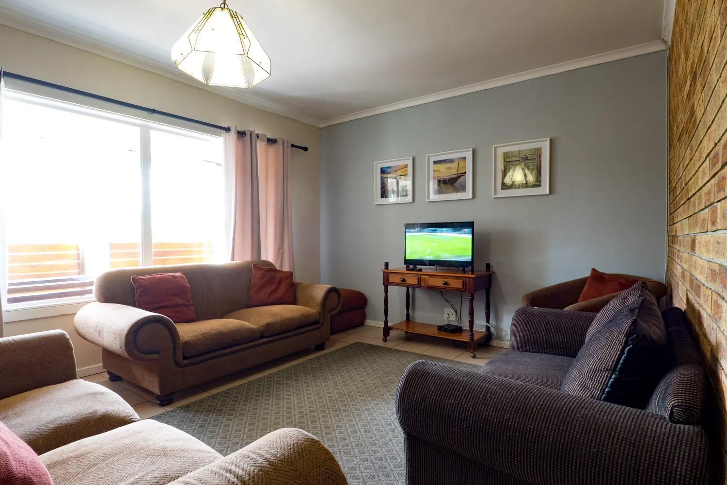 Communal lounge/ TV room in Carrington Guest House