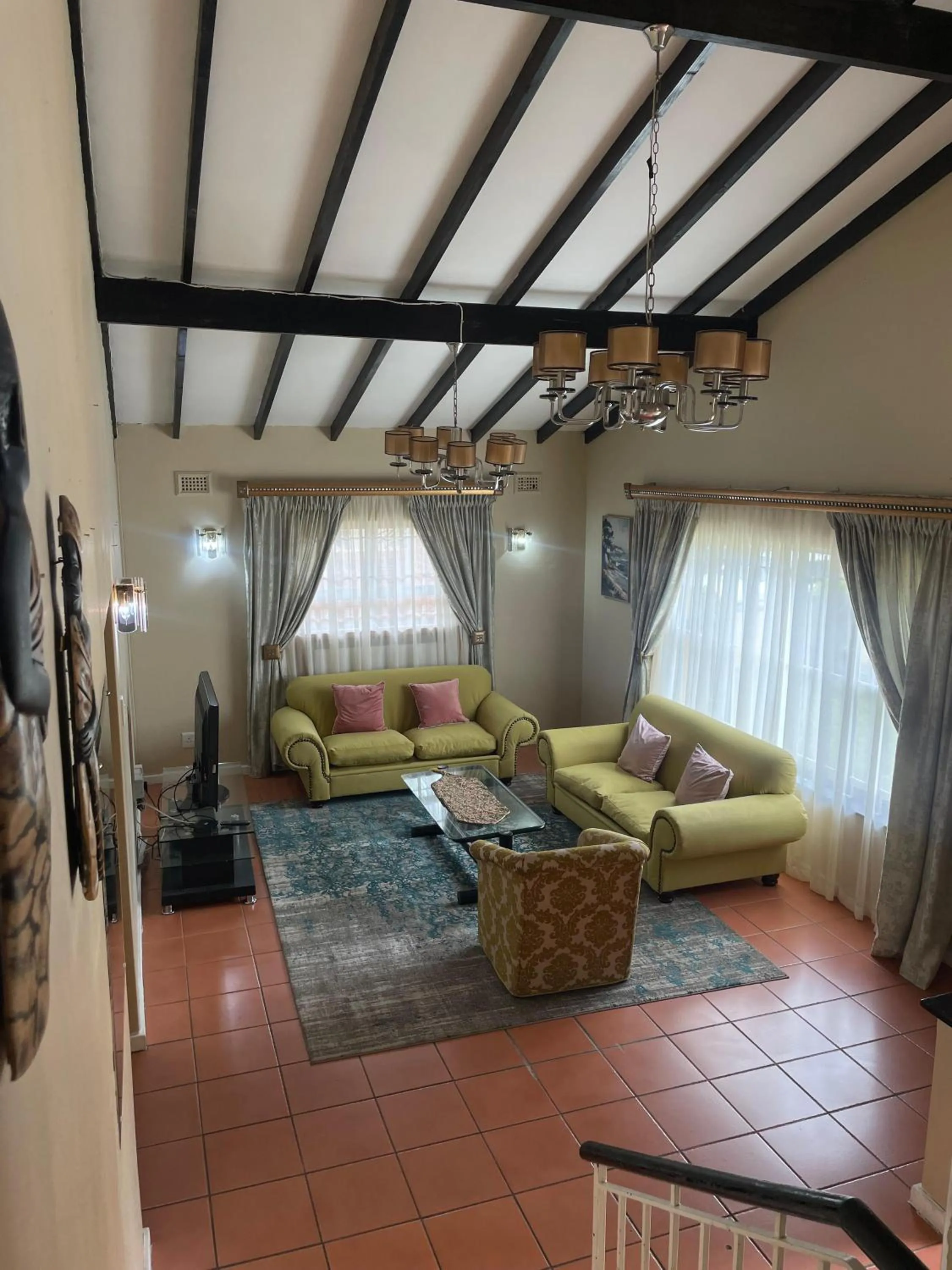 Communal lounge/ TV room in Carrington Guest House