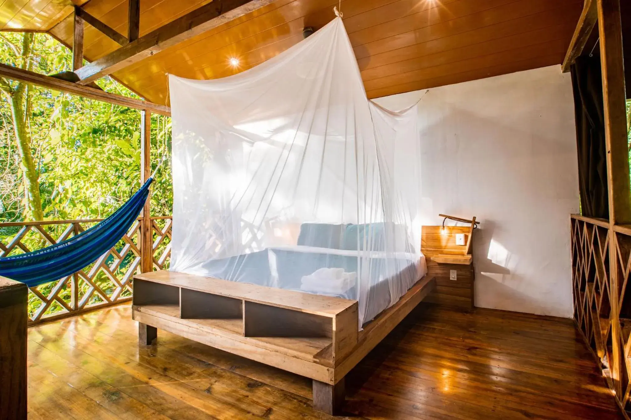 Bed in Palmar Beach Lodge Bed in Palmar Beach Lodge