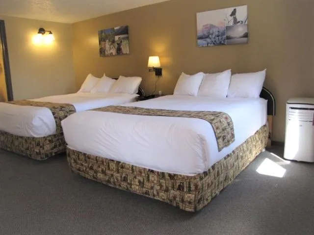 Bed in Bear Country Inn and Suites