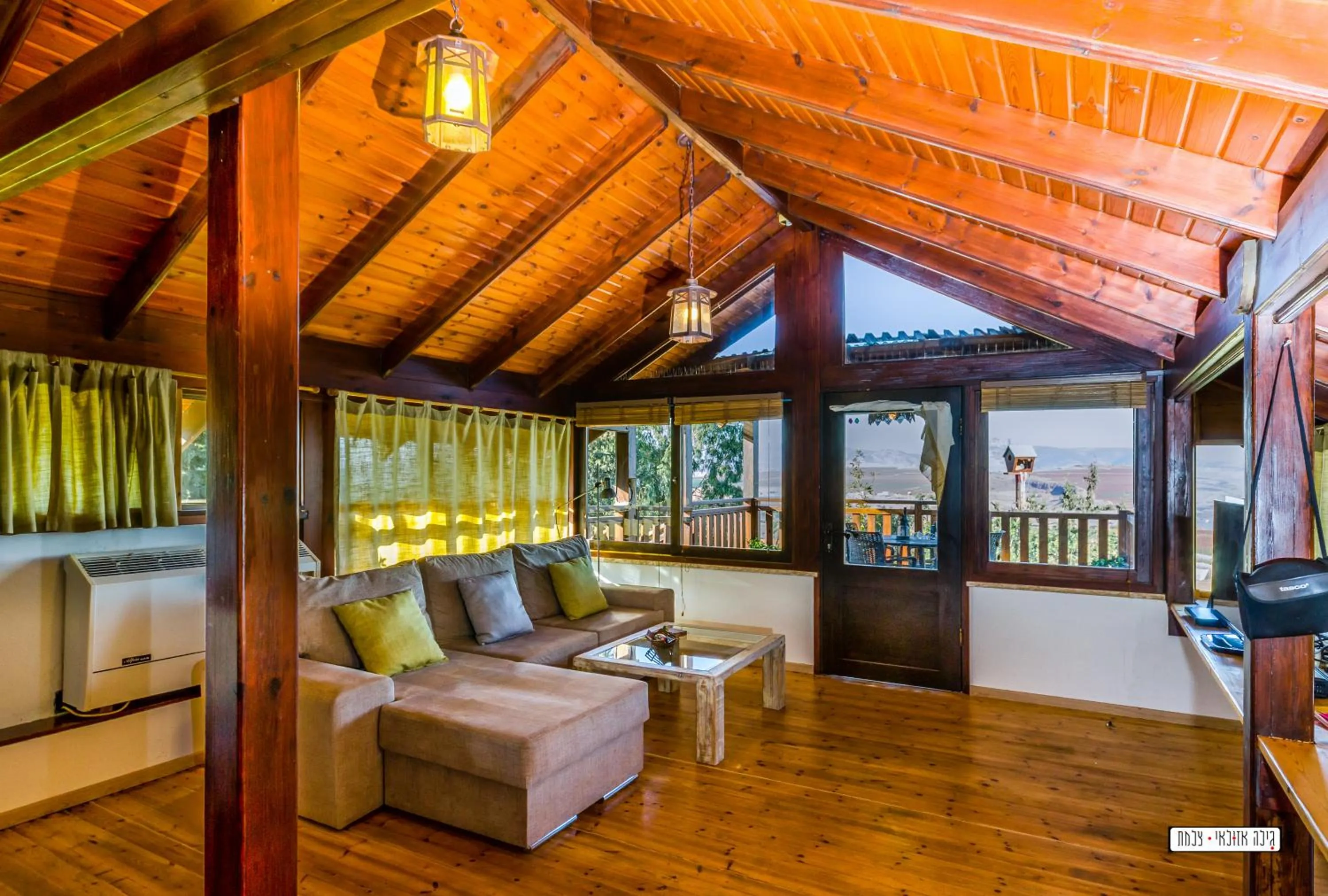 Living room in Beautiful Lake View Wooden House