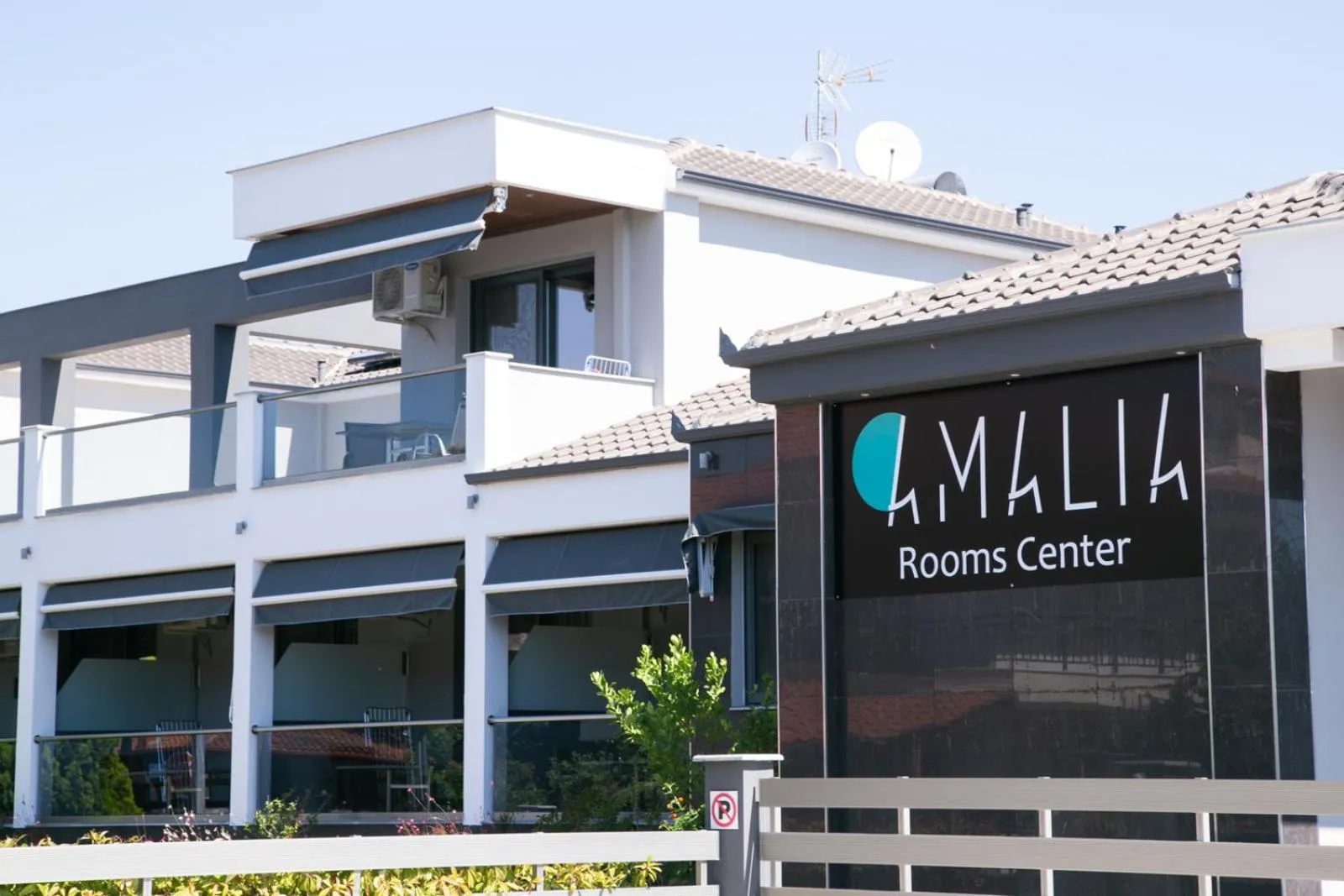 Property logo or sign in Amalia Center