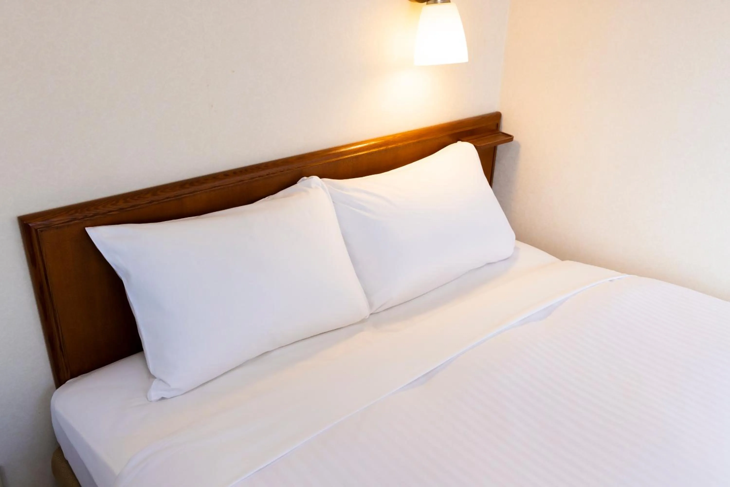 Bed in Natural Hot Spring Ariston Hotel Oita