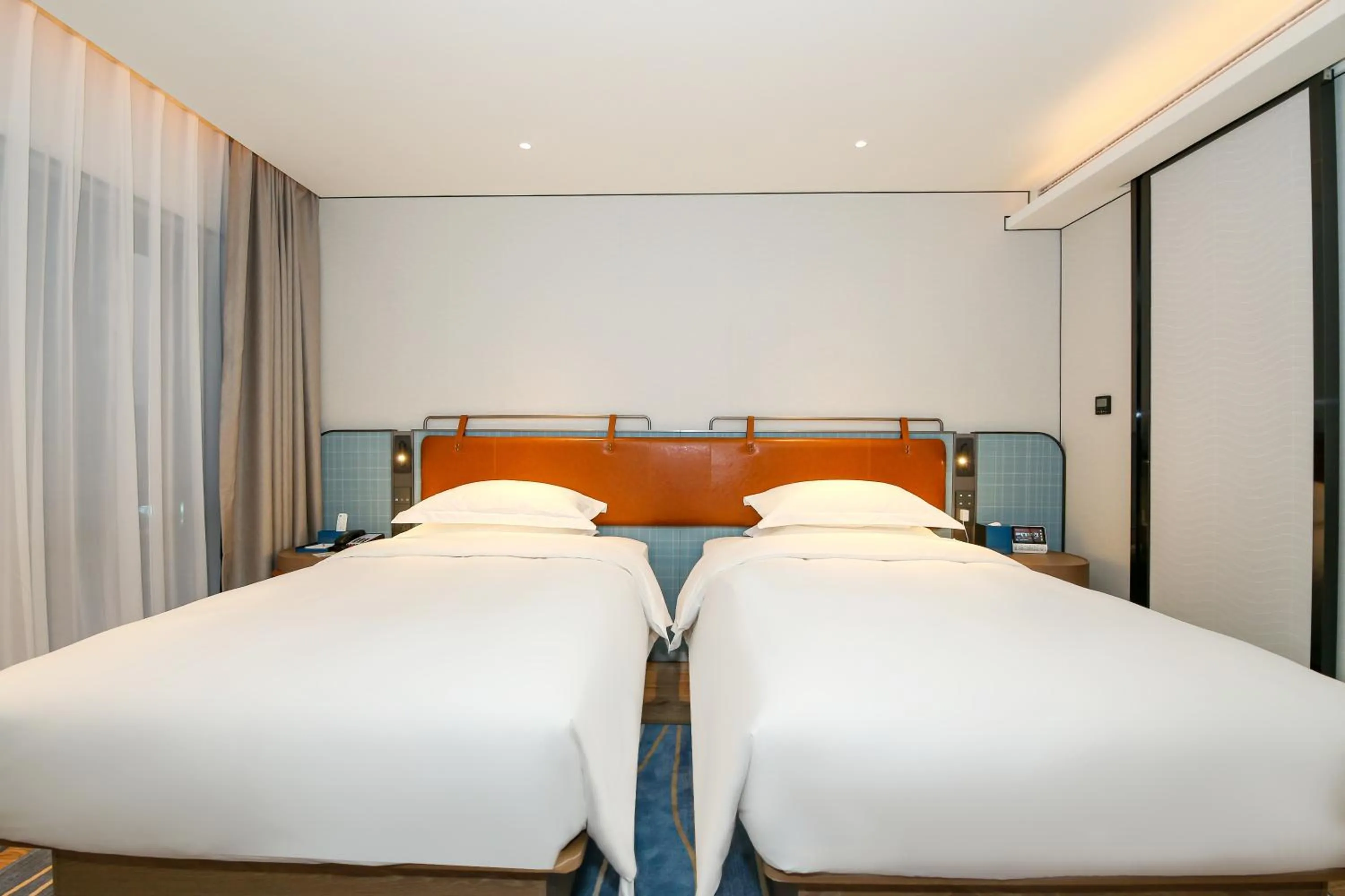 Bed in Echarm Plus International Hotel Guangzhou South Railway Station Zhongcun Metro Station Branch