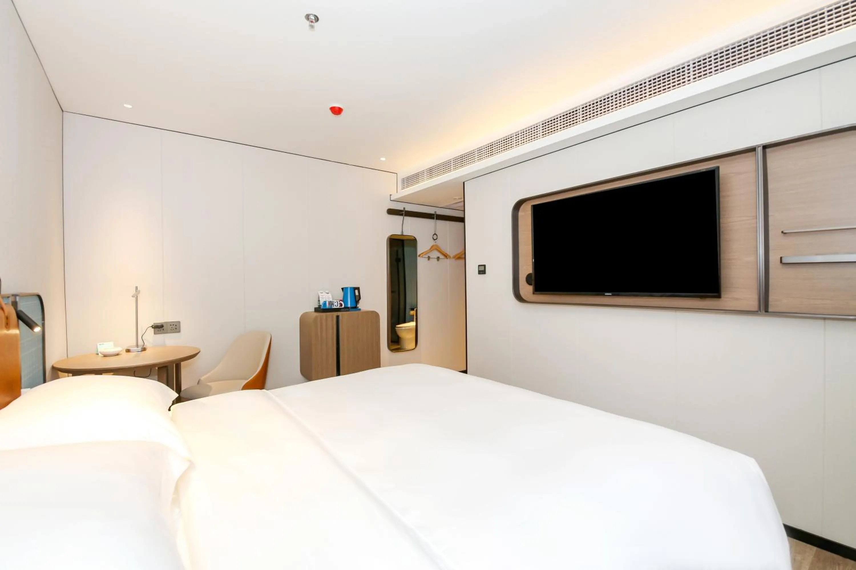 Bed in Echarm Plus International Hotel Guangzhou South Railway Station Zhongcun Metro Station Branch