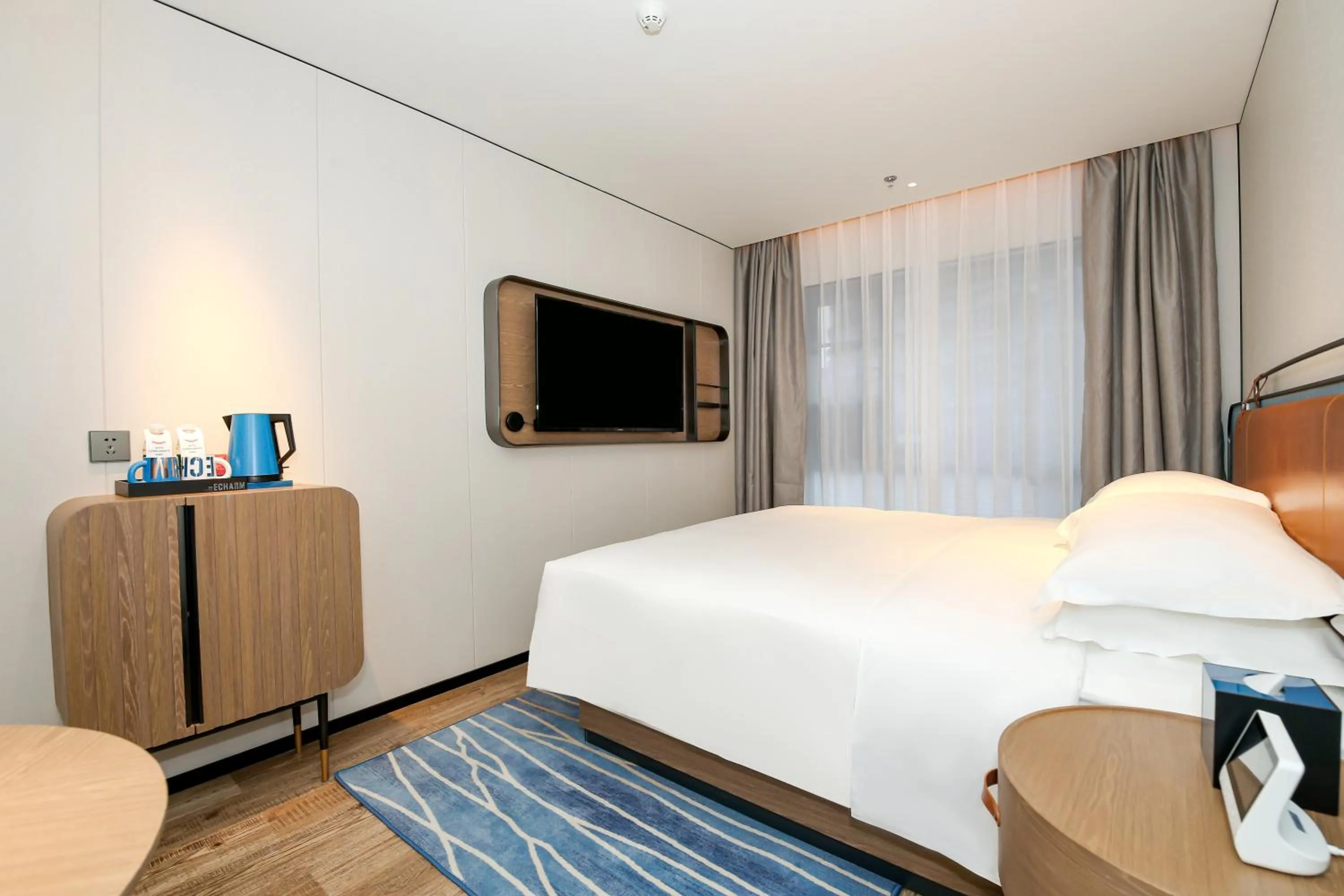 Bed in Echarm Plus International Hotel Guangzhou South Railway Station Zhongcun Metro Station Branch