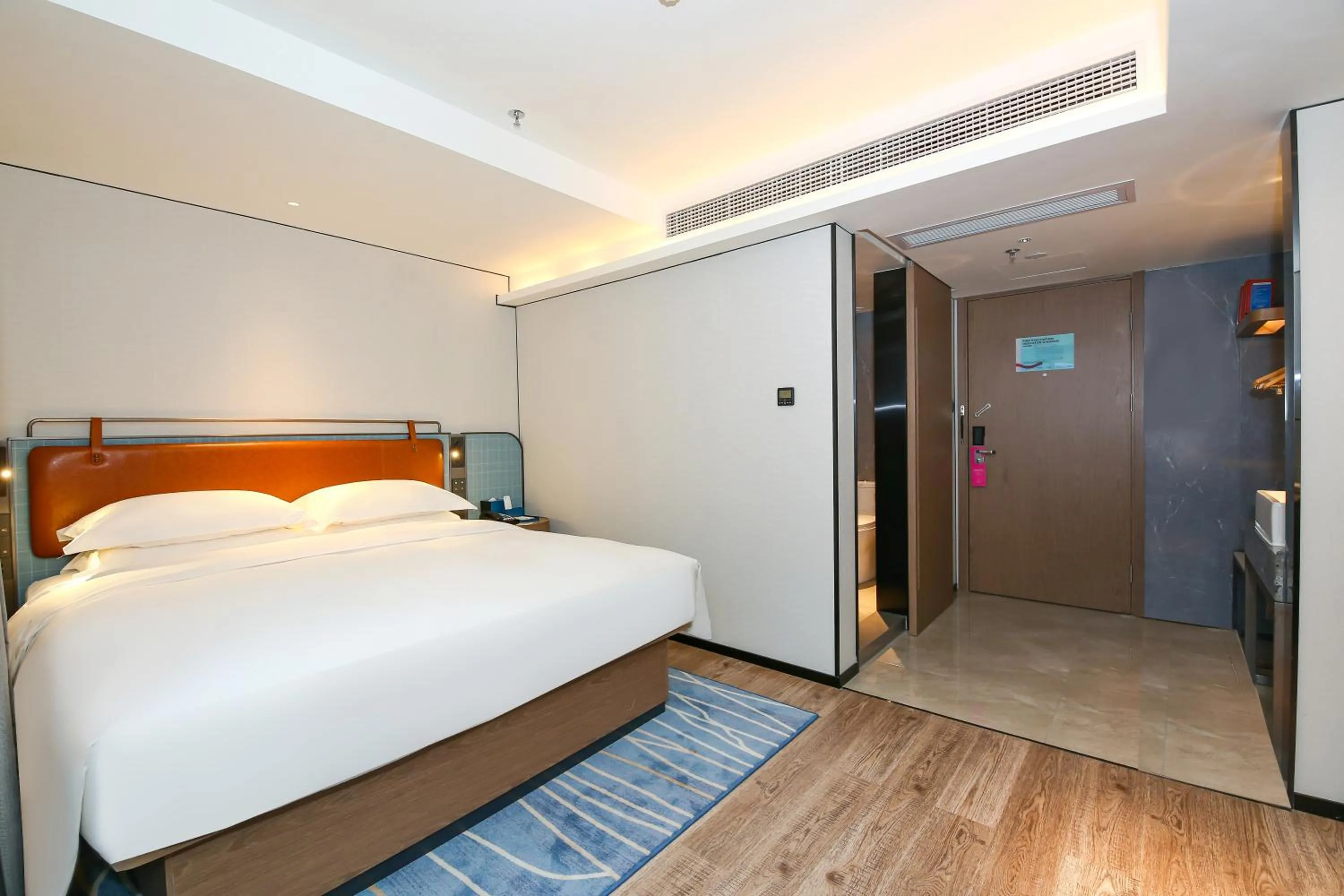 Bed in Echarm Plus International Hotel Guangzhou South Railway Station Zhongcun Metro Station Branch
