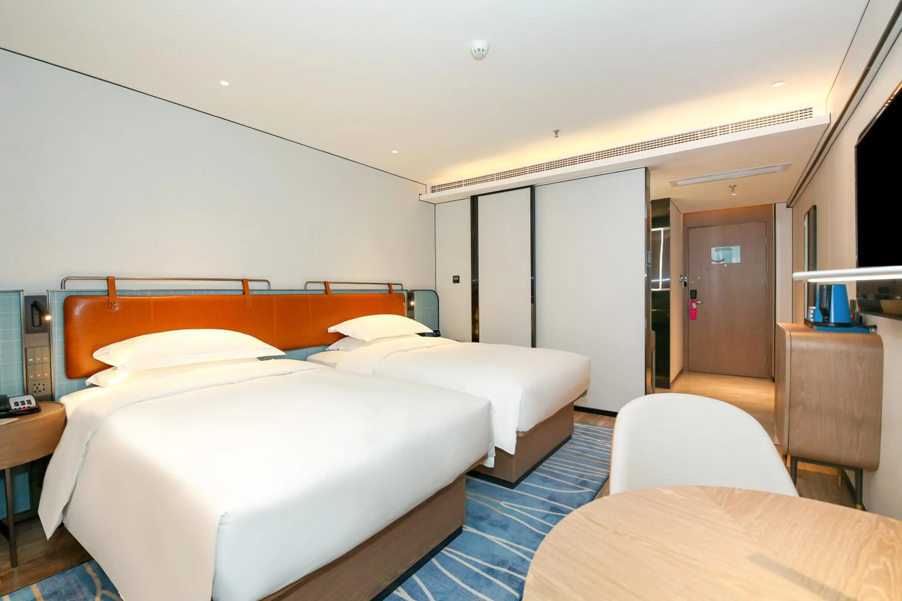 Bed in Echarm Plus International Hotel Guangzhou South Railway Station Zhongcun Metro Station Branch