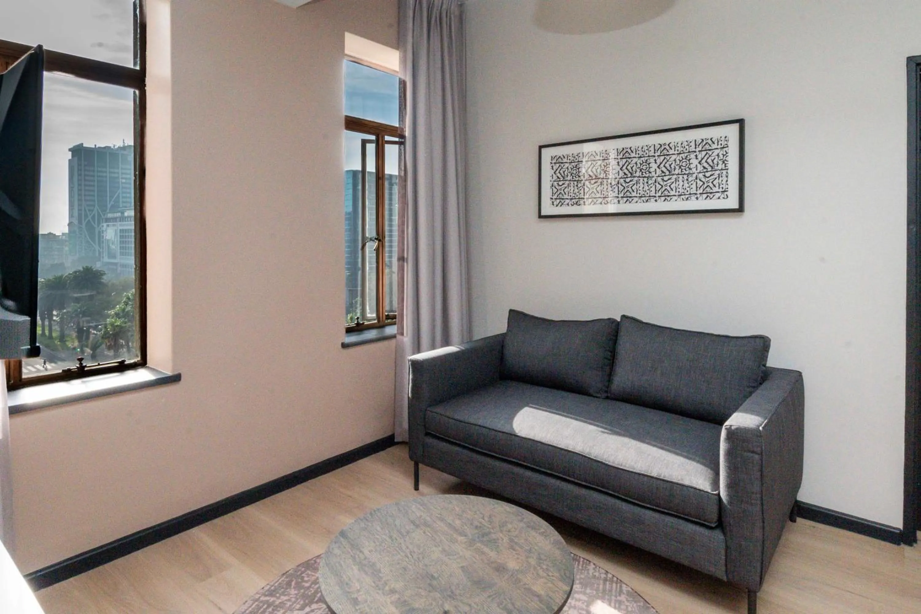 Seating area in HAVN Aparthotel by Totalstay