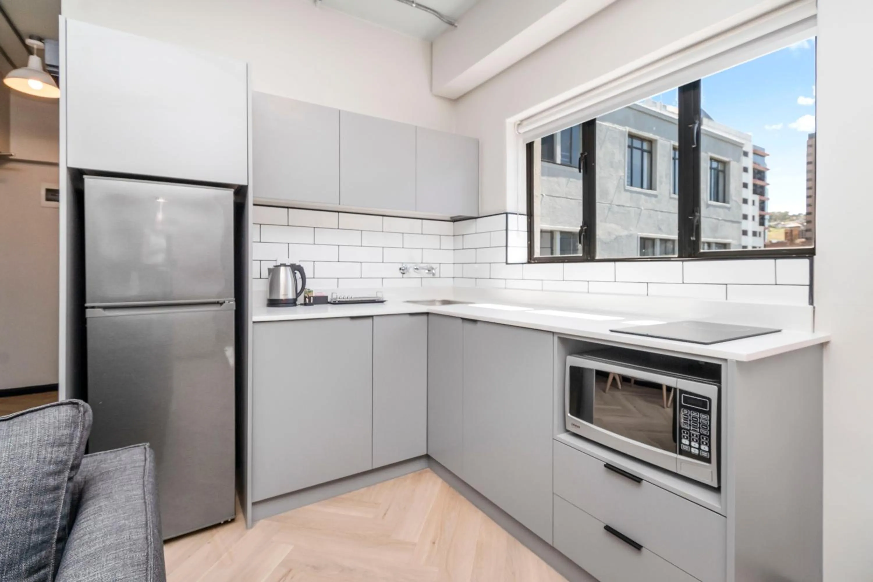 Kitchen or kitchenette in HAVN Aparthotel by Totalstay