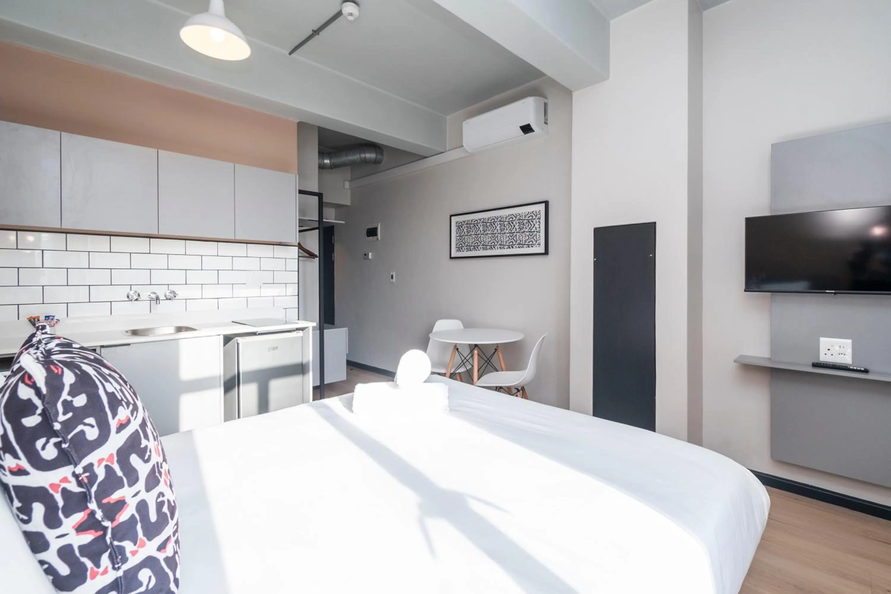 Bed in HAVN Aparthotel by Totalstay