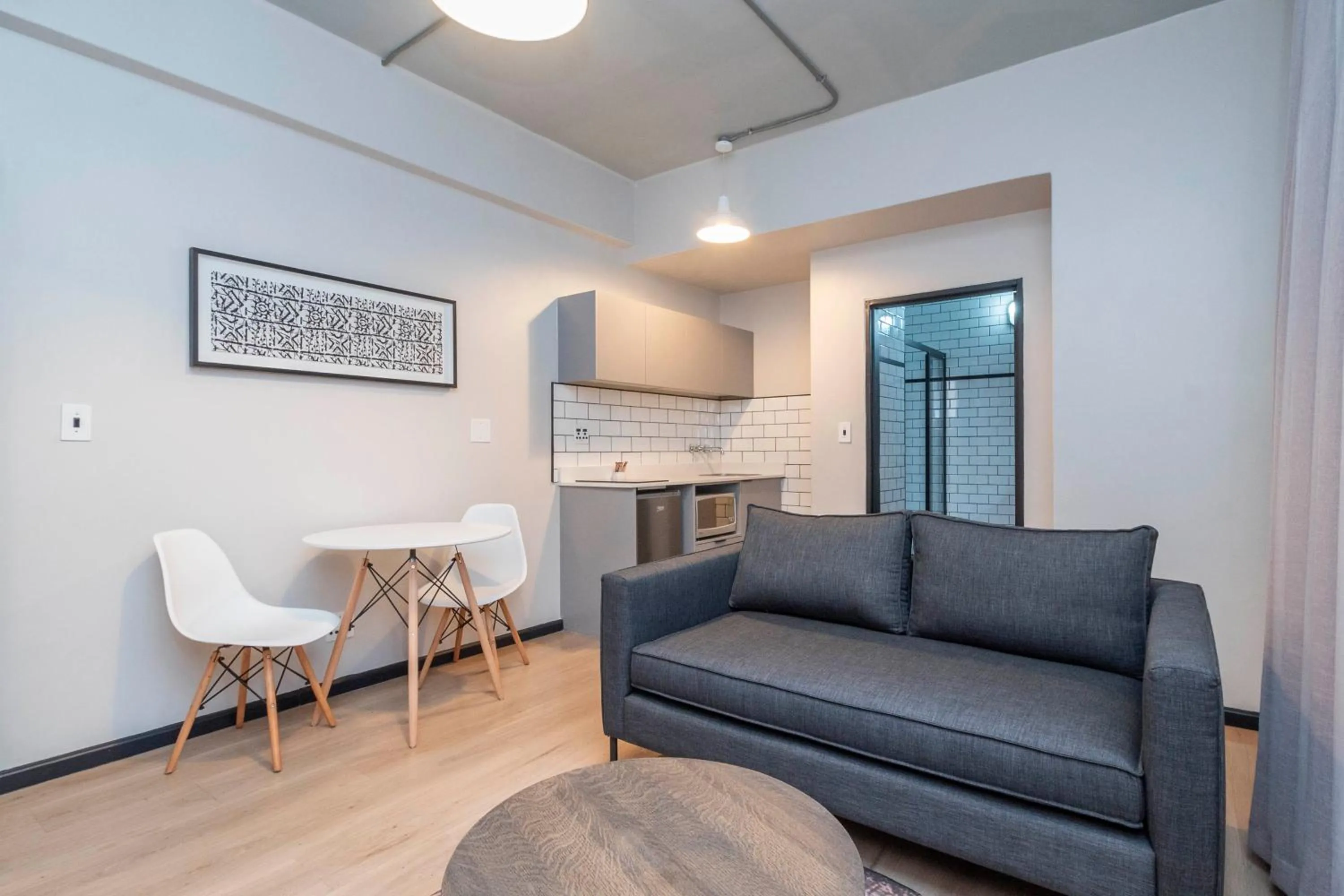 Seating area in HAVN Aparthotel by Totalstay