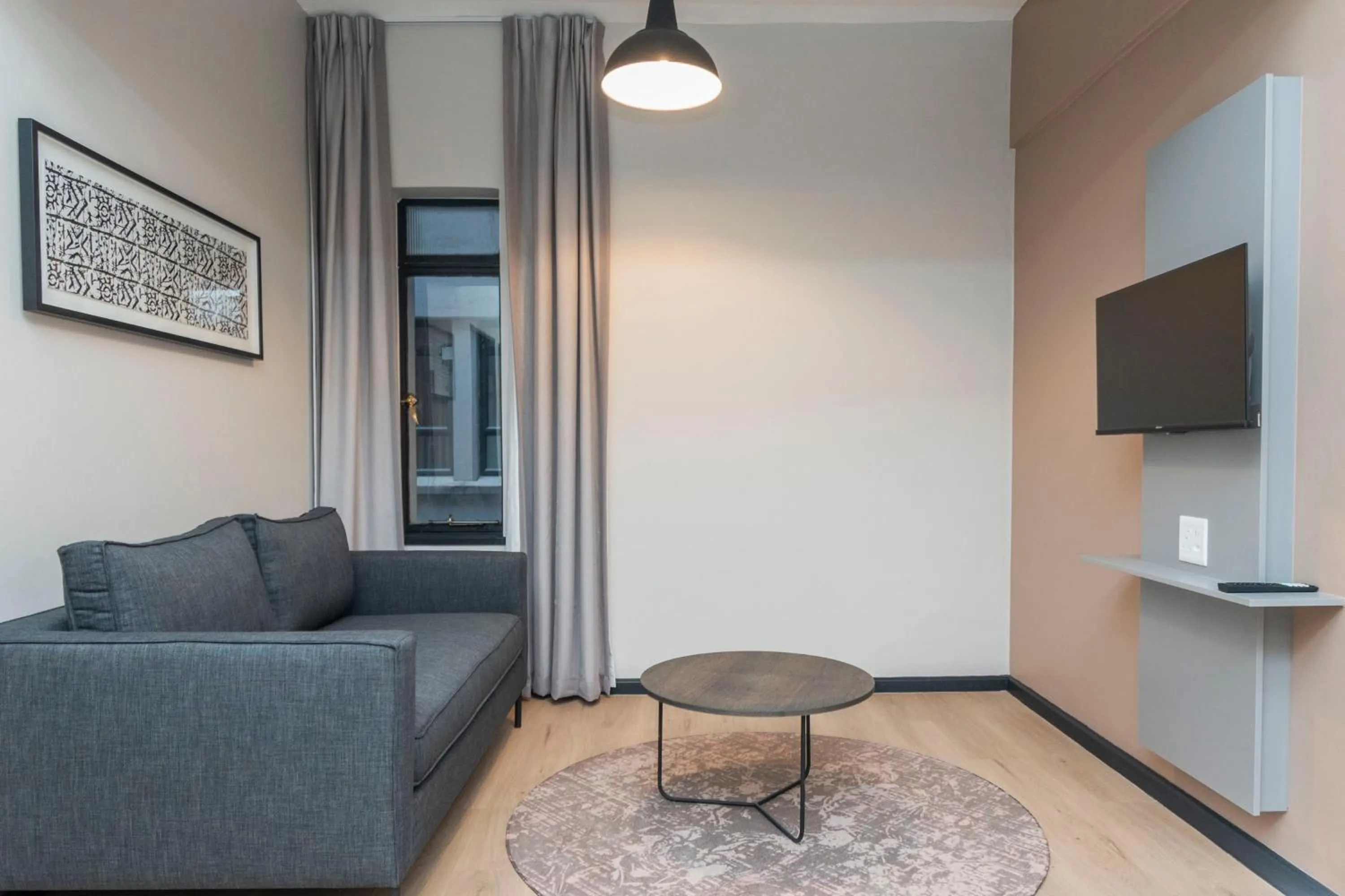 Seating area in HAVN Aparthotel by Totalstay