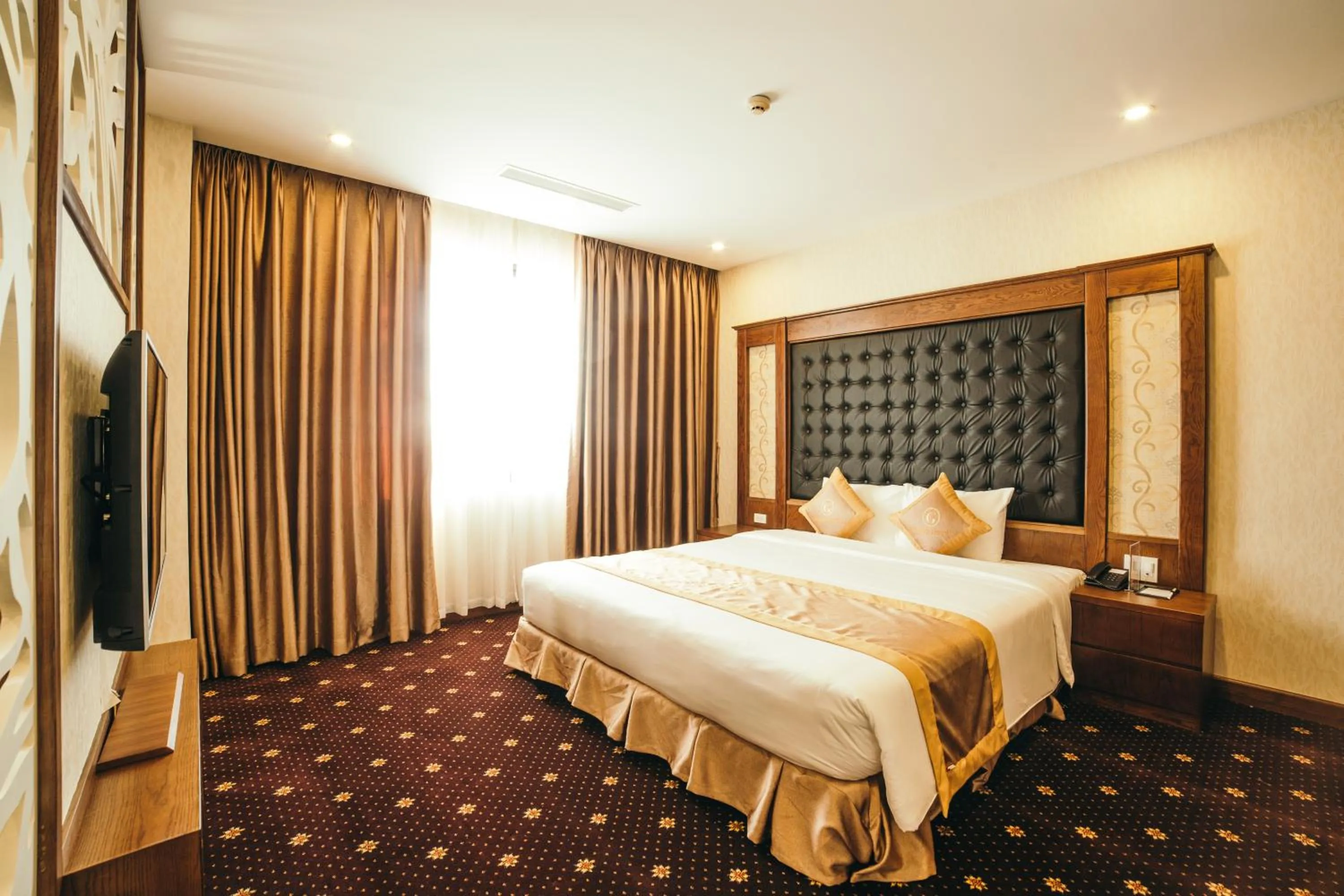 Bed in Grand Móng Cái Hotel