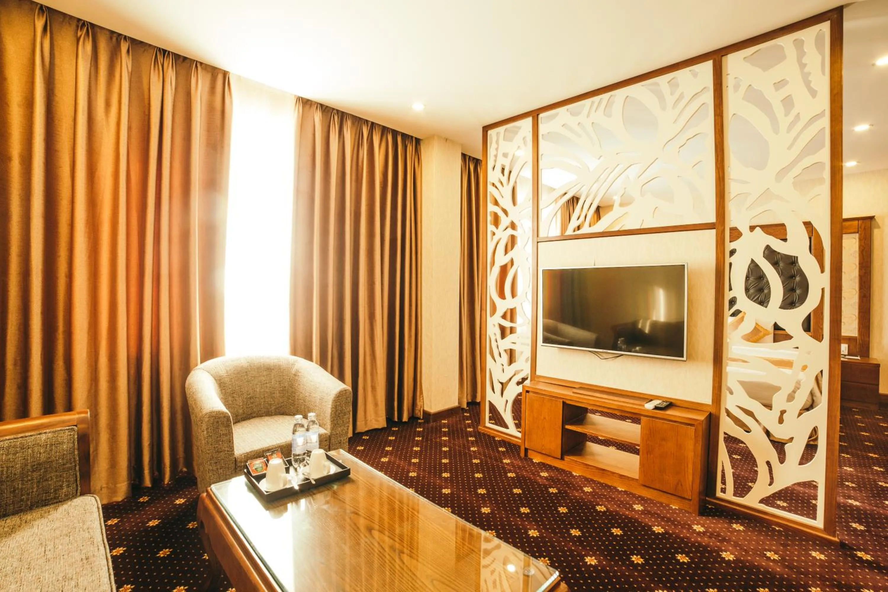 Communal lounge/ TV room in Grand Móng Cái Hotel