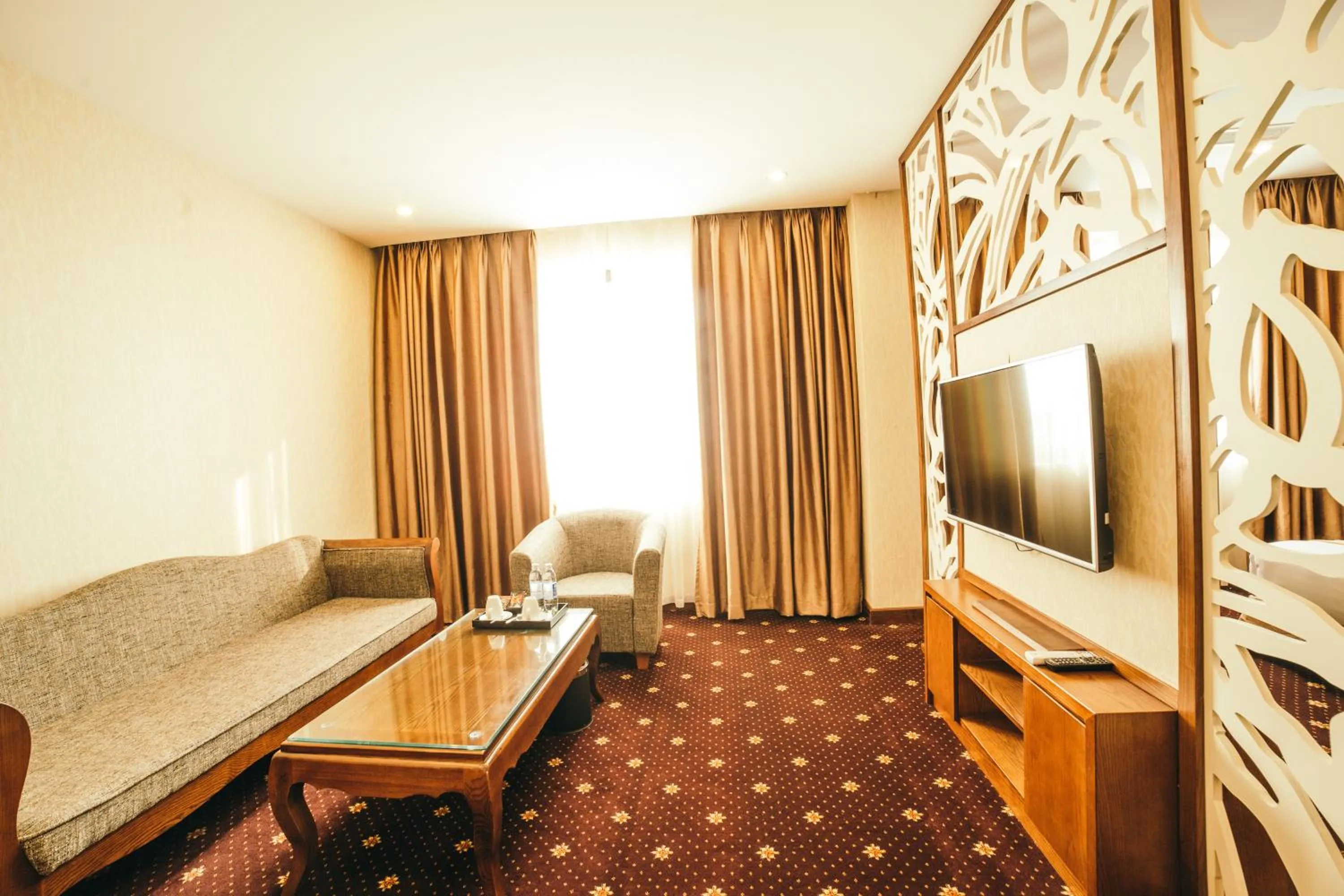 Communal lounge/ TV room in Grand Móng Cái Hotel