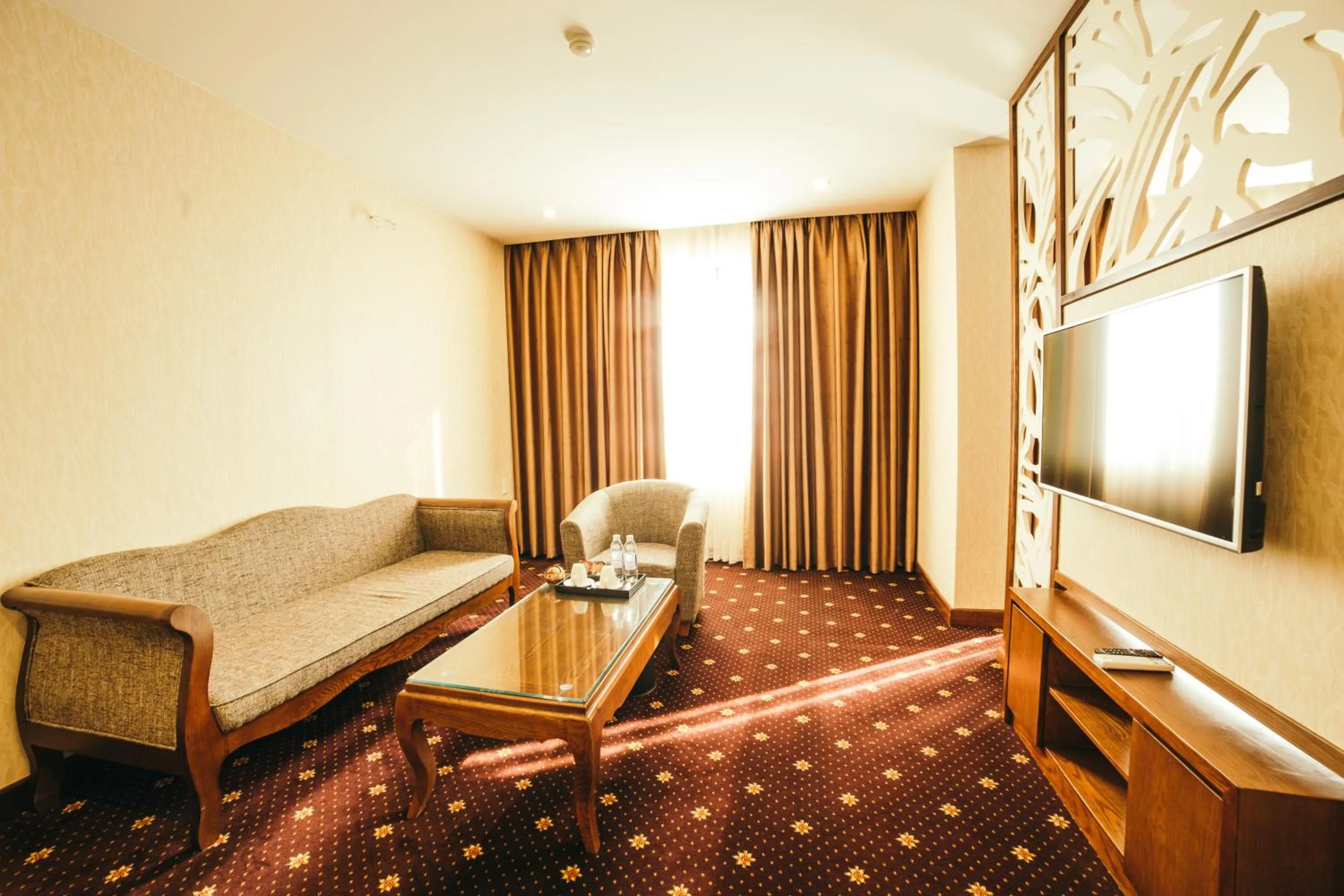 Communal lounge/ TV room, Bed in Grand Móng Cái Hotel