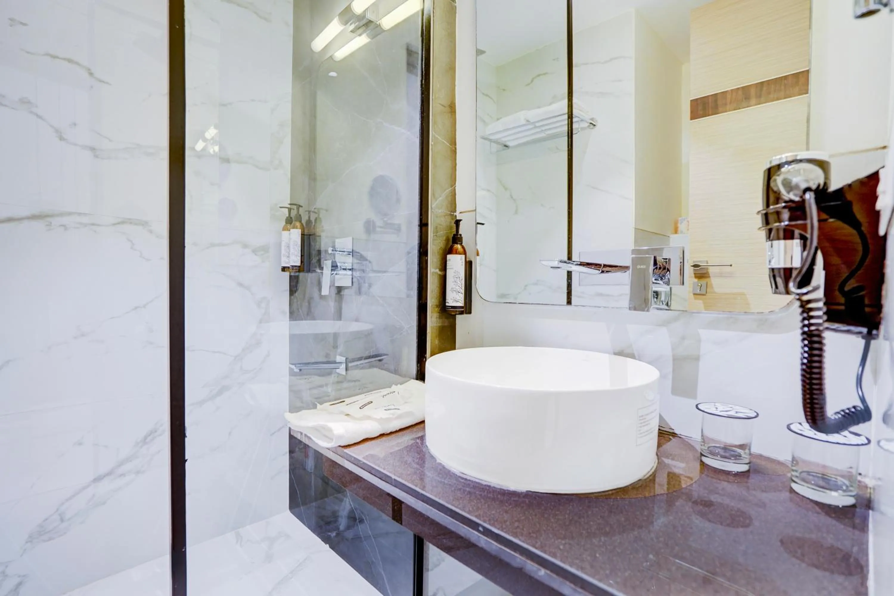 Shower in Sunday Hotel & Residences by CheckIn Gurugram