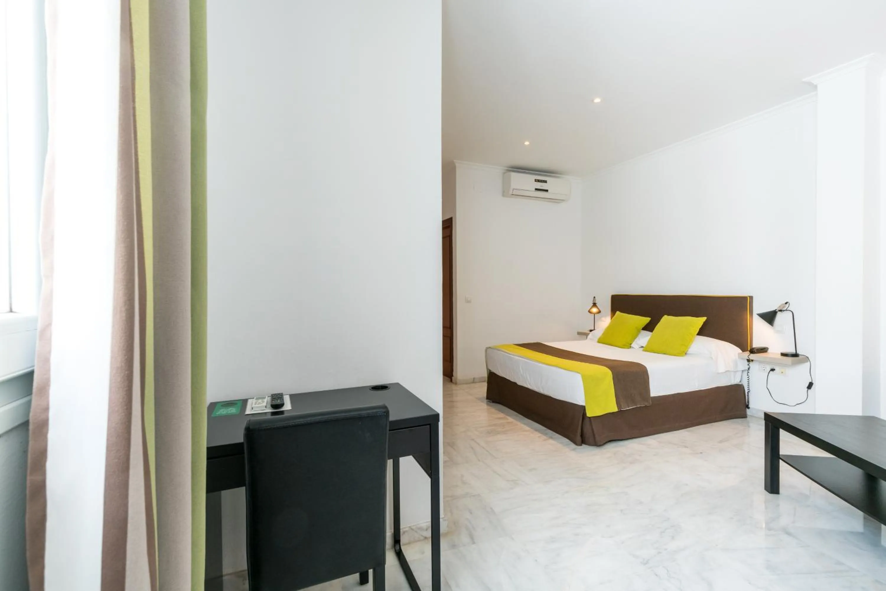 Bed in Cool Sevilla Hotel