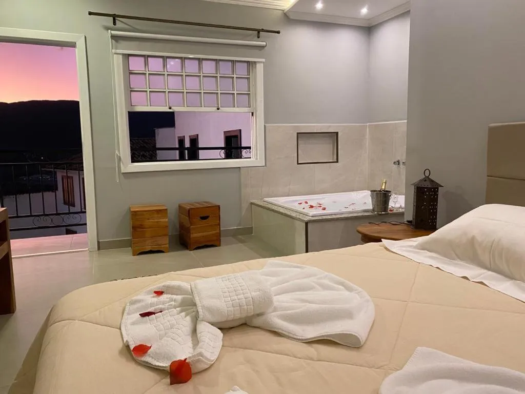 Bed in Pousada Maria Monteiro Tiradentes