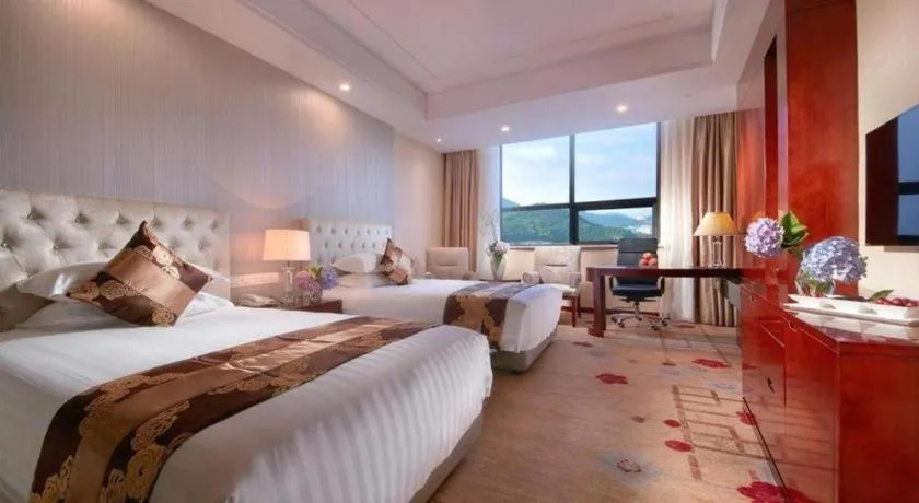Bed in New Century Hotel Putuo Zhoushan